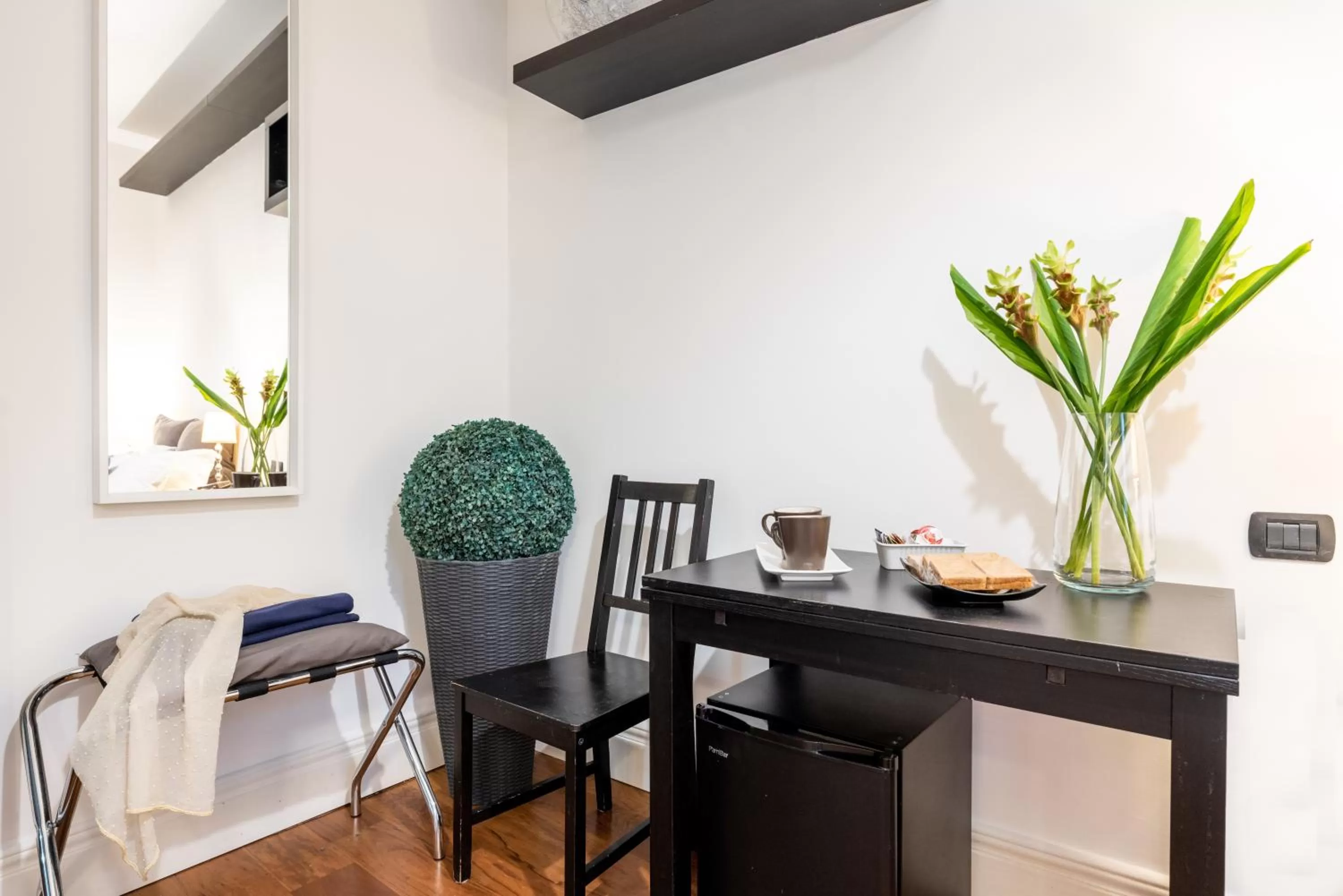 Bedroom, TV/Entertainment Center in Suite 36 - NEW OPENING