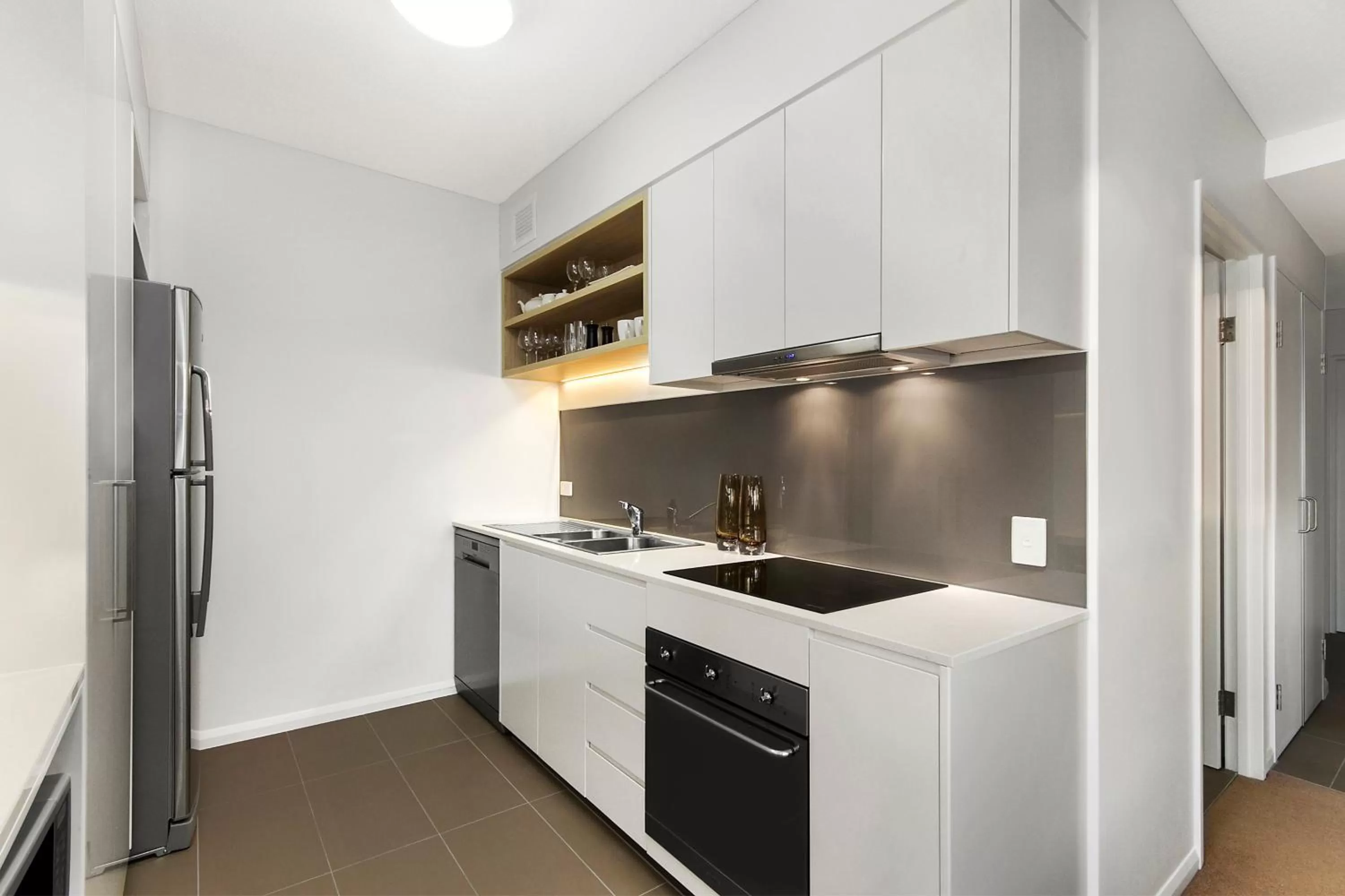 Kitchen or kitchenette in Allure Hotel & Apartments