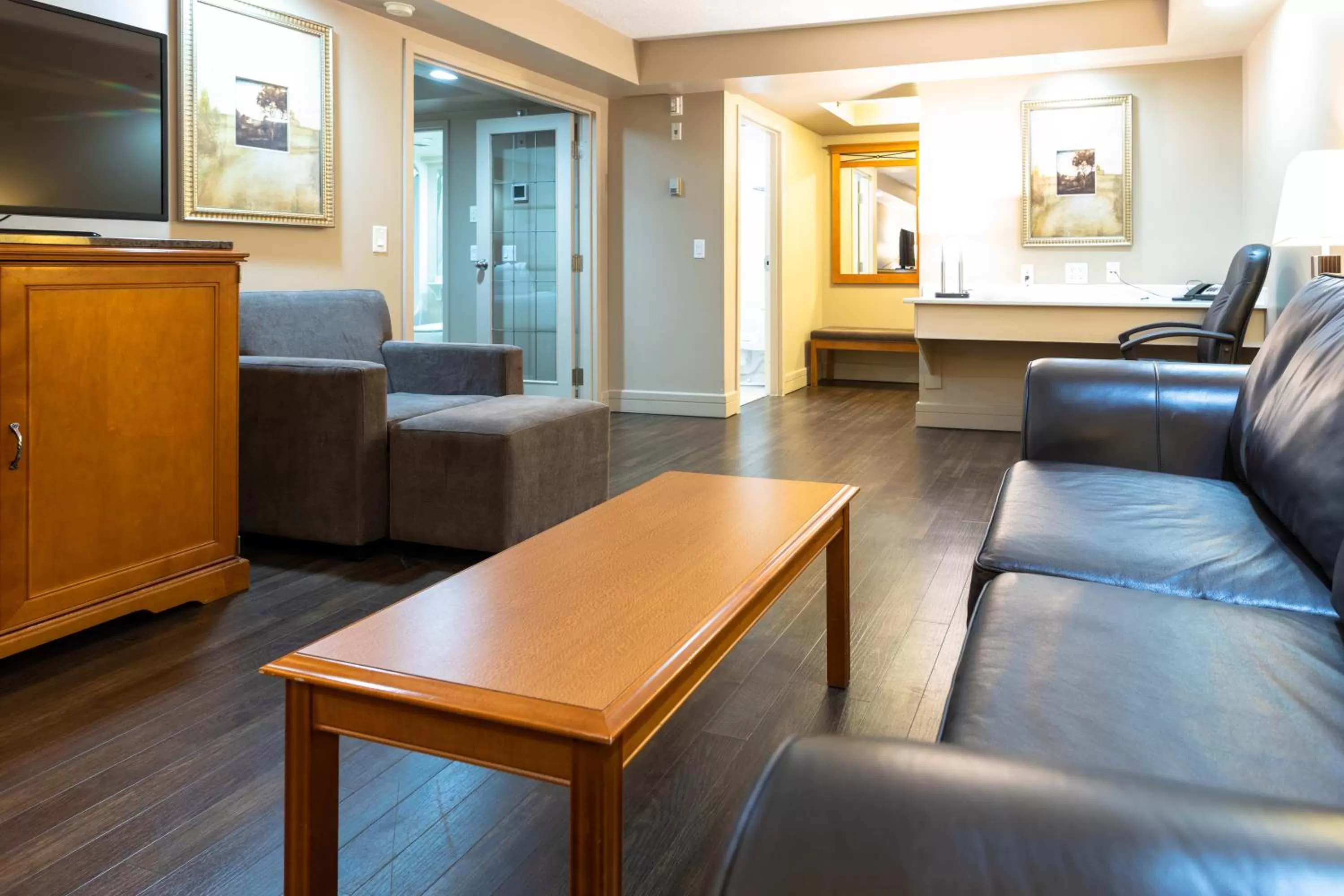 Living room in Royal Hotel West Edmonton, Trademark Collection by Wyndham
