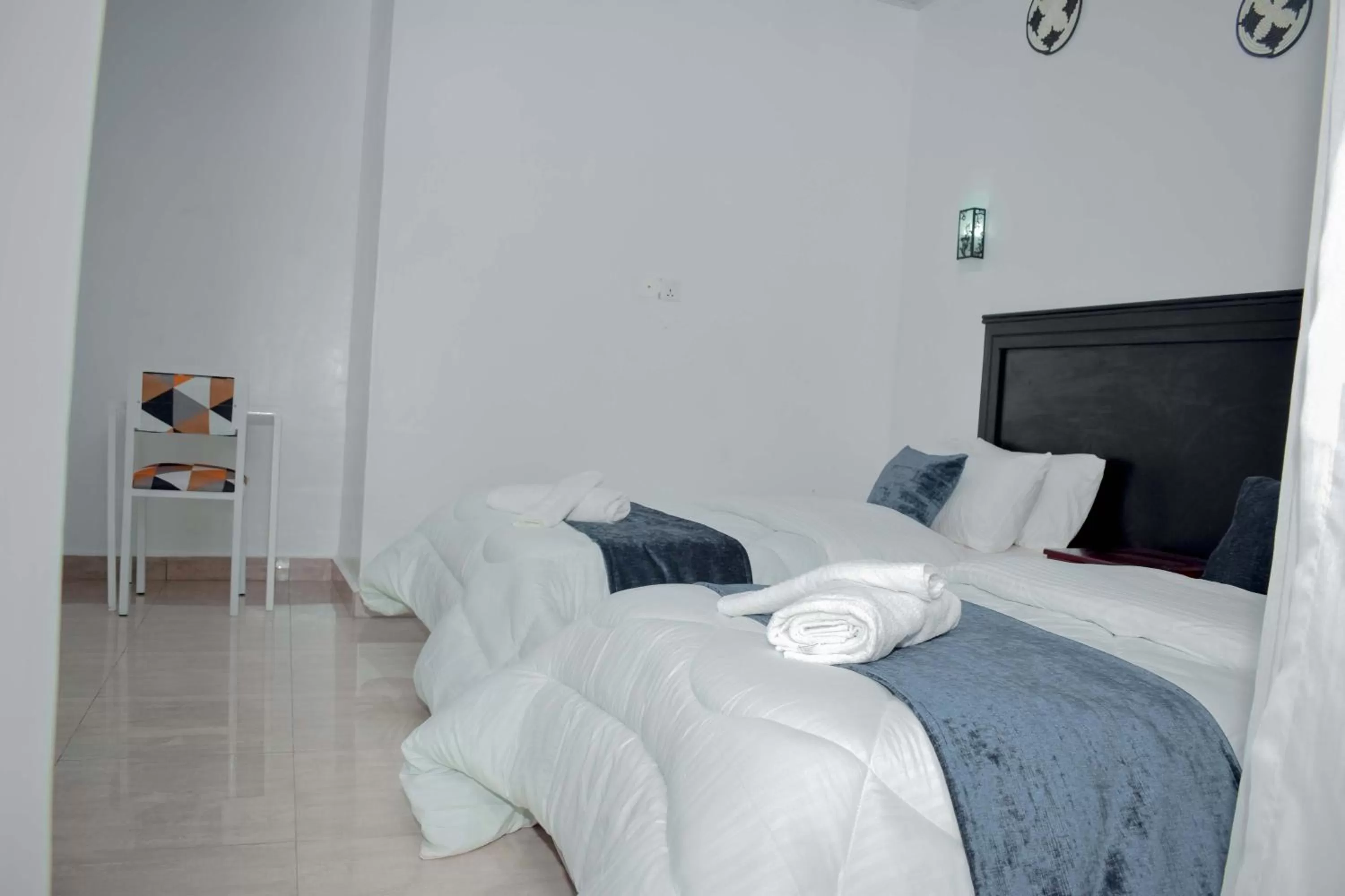 Bed in INZOZI AFRICA HOUSE B&B-Gishushu