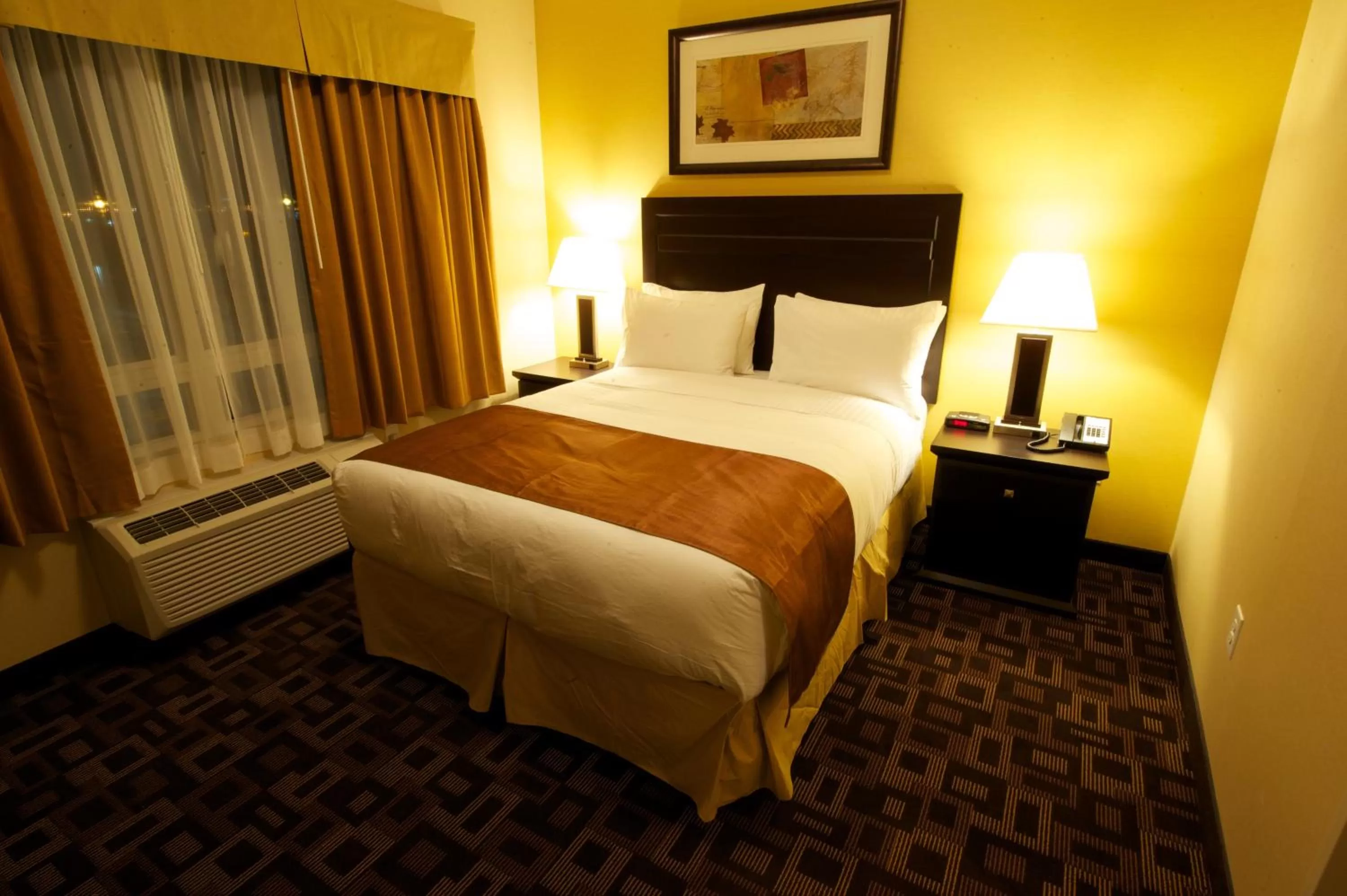 Bed in Days Inn & Suites by Wyndham Winnipeg Airport Manitoba