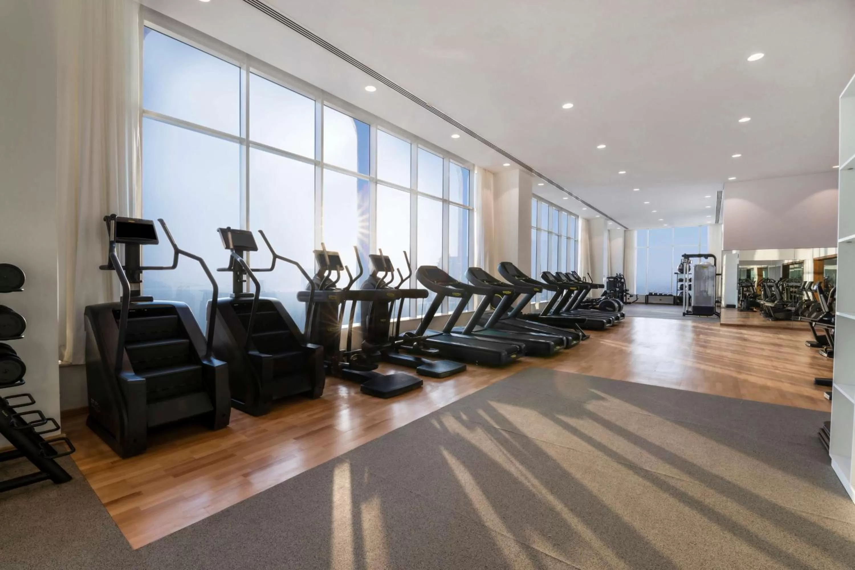 Fitness centre/facilities in Aleph Doha Residences, Curio Collection By Hilton