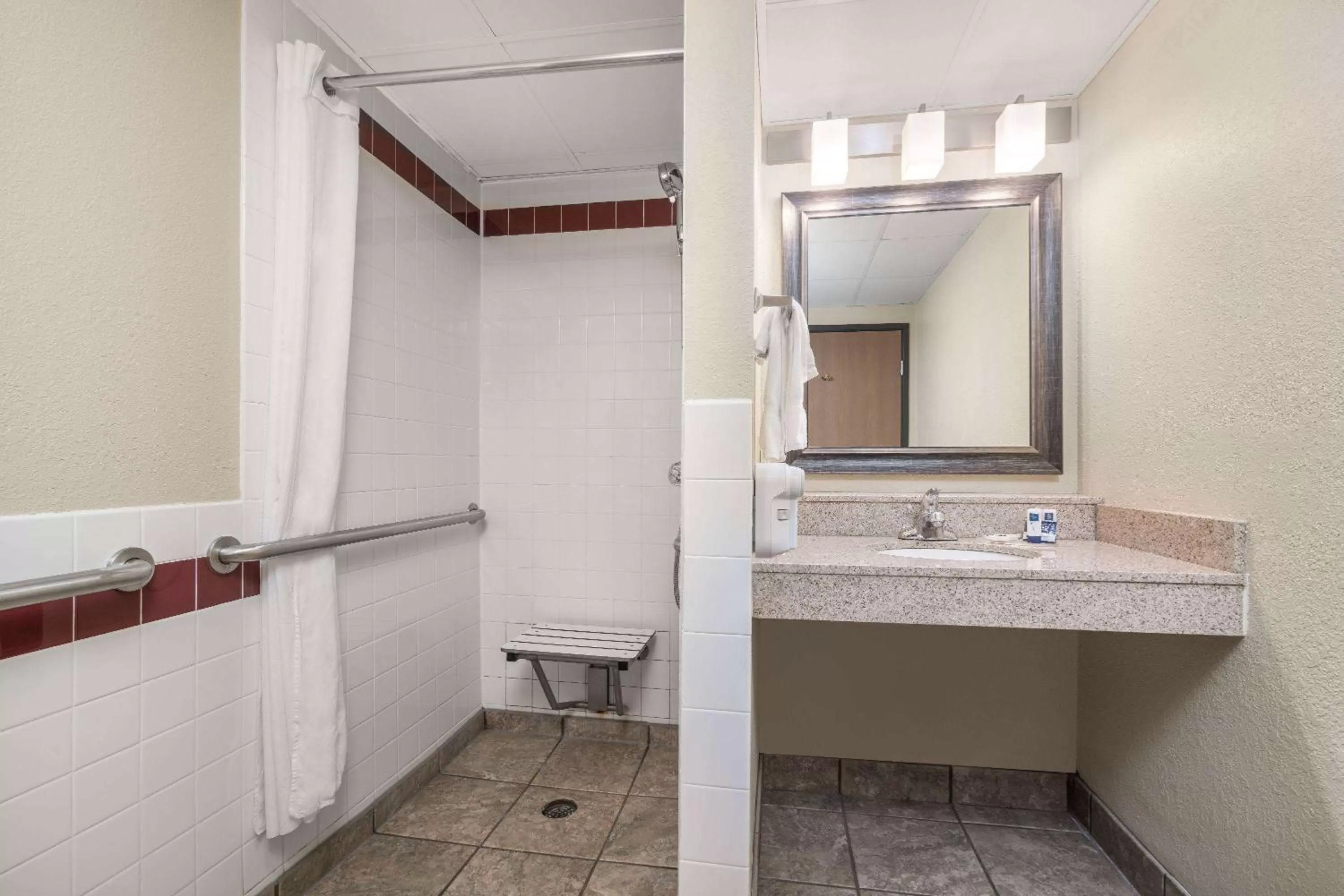 Bathroom in AmericInn by Wyndham Fargo West Acres