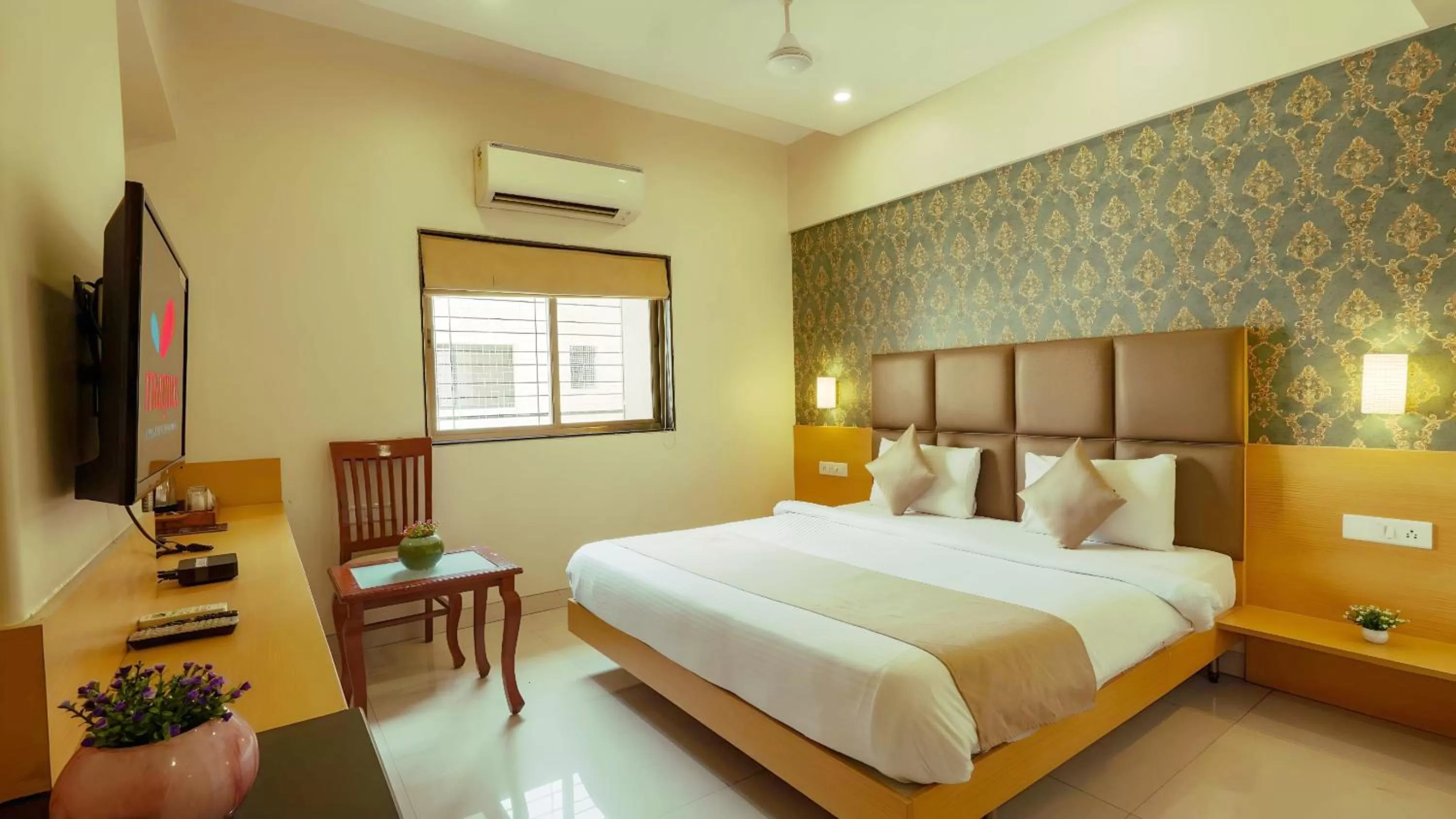 Bed in Magnus Square Business Hotel near Pune Airport