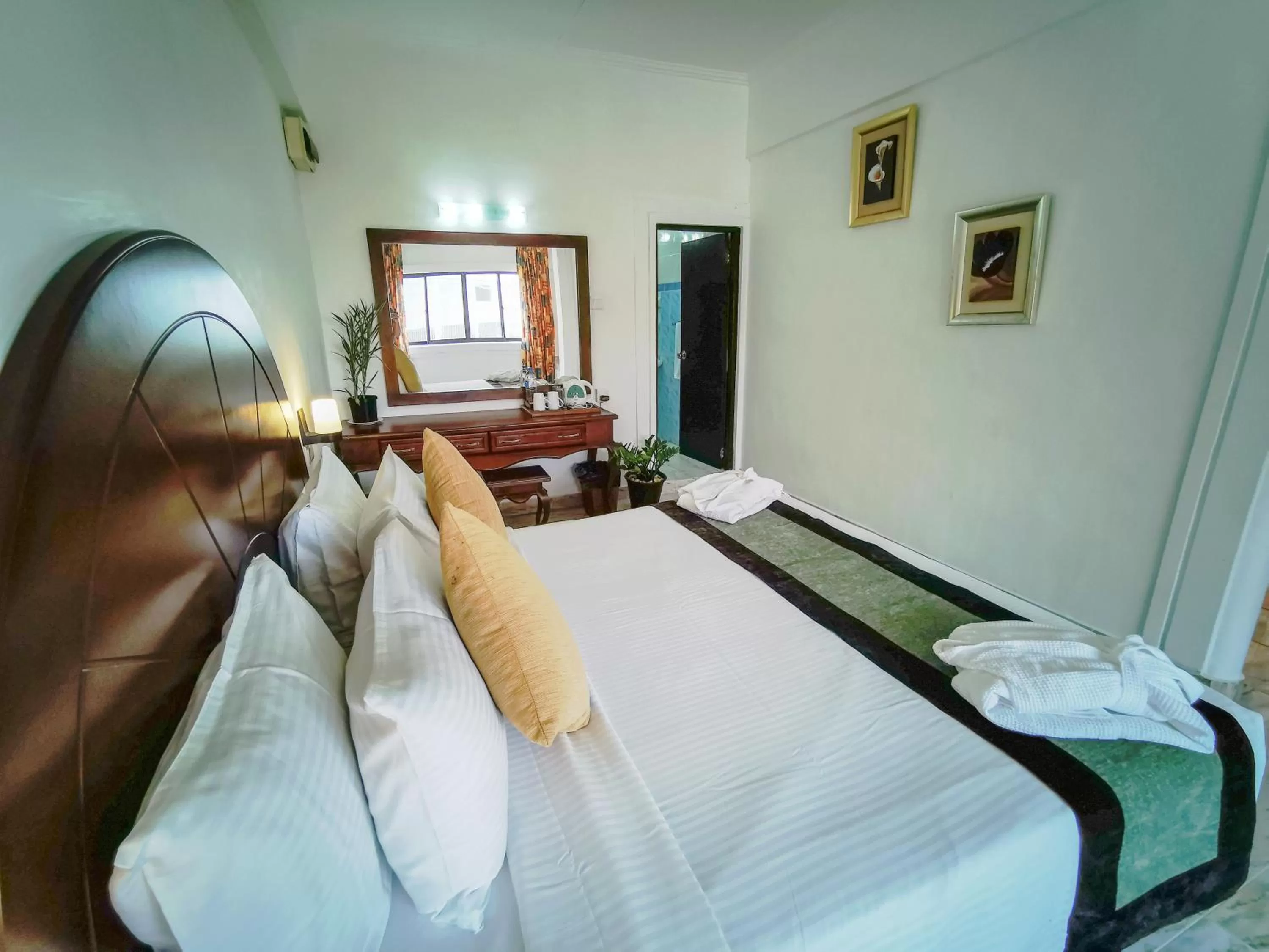 Bed in Camelot Beach Hotel