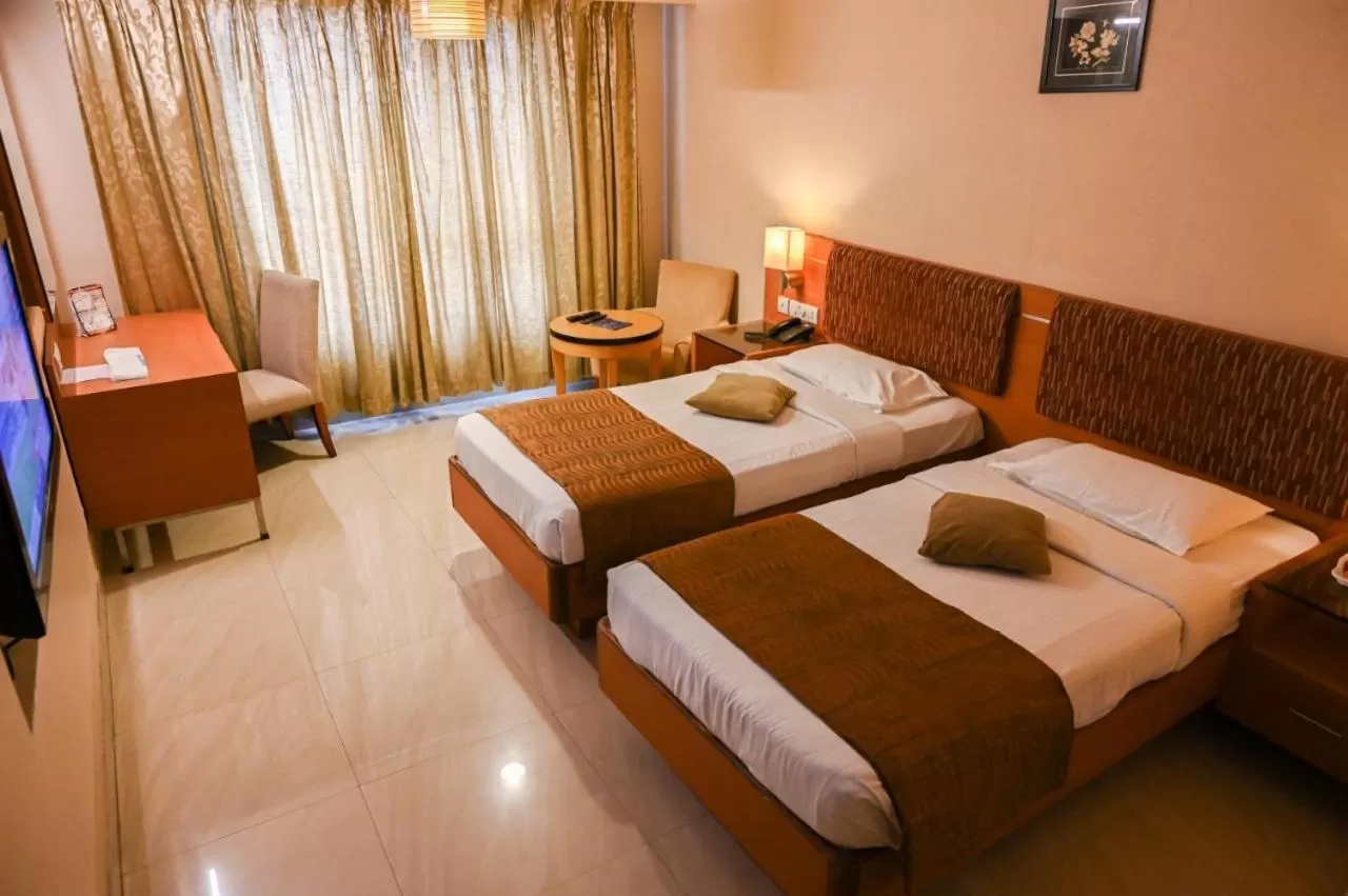 Bed in PLA Krishna Inn