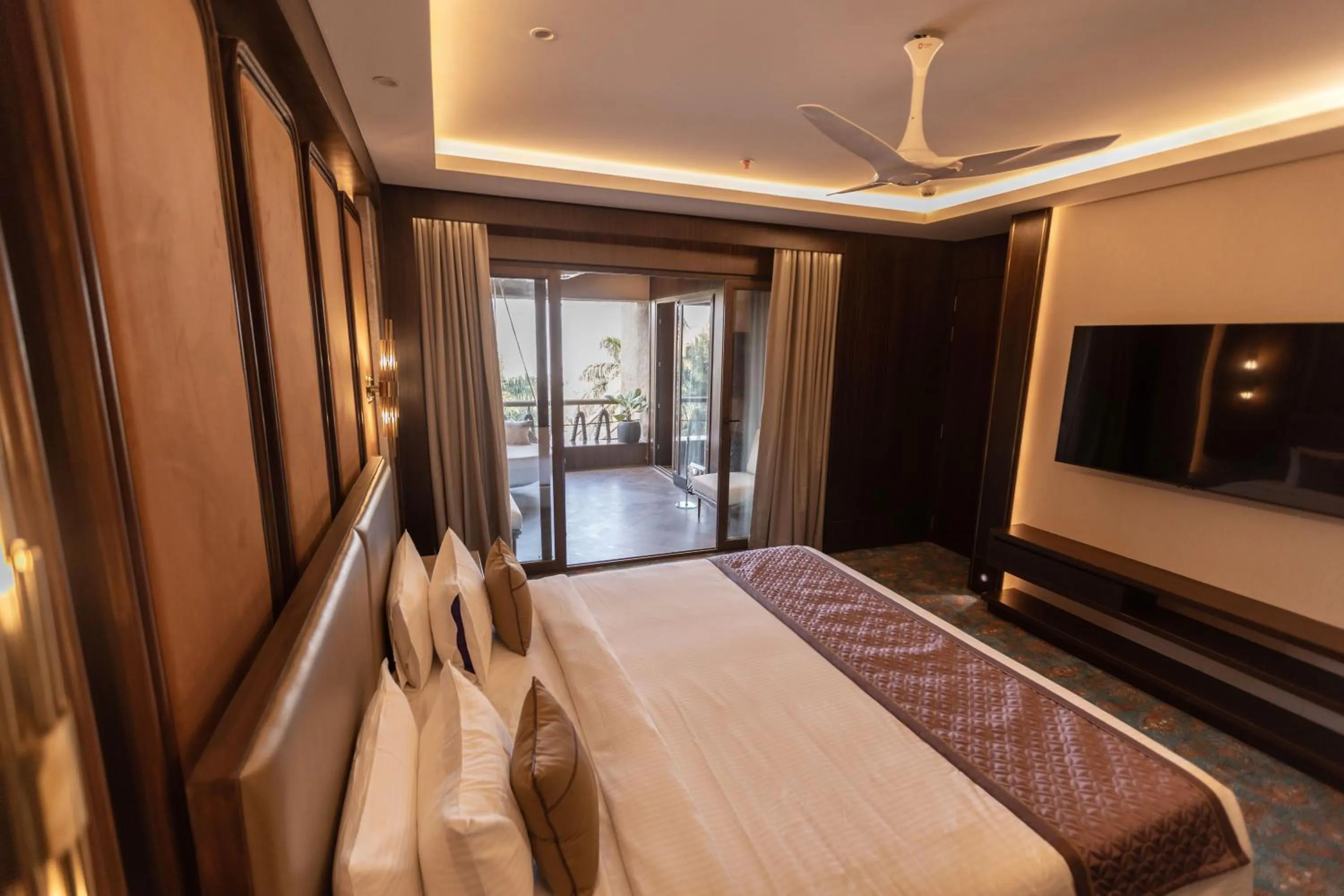 Seating area, Bed in The Corinthians Resort