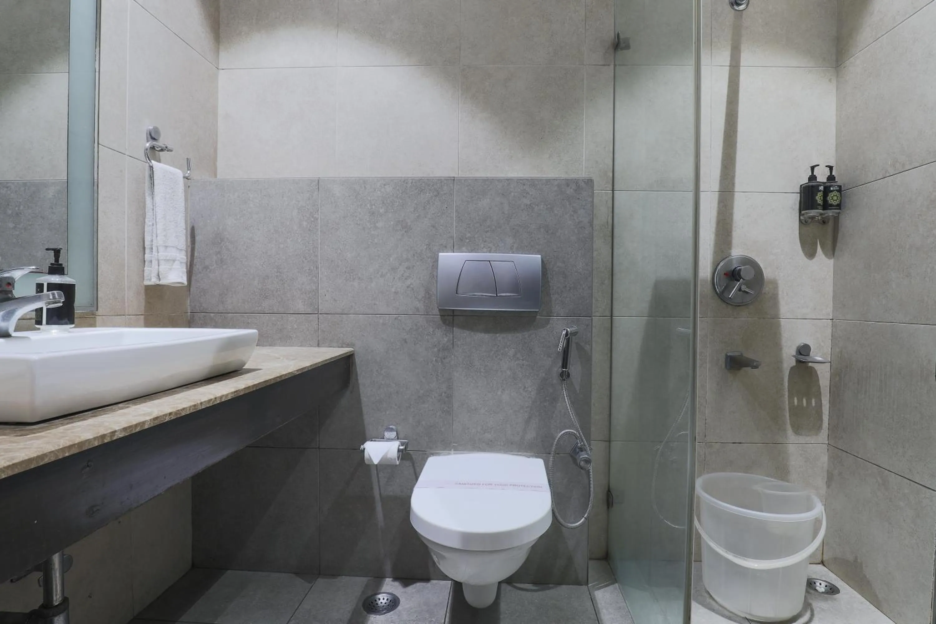 Bathroom in Cosy Grand, Chanakyapuri by The Cosy Hotels