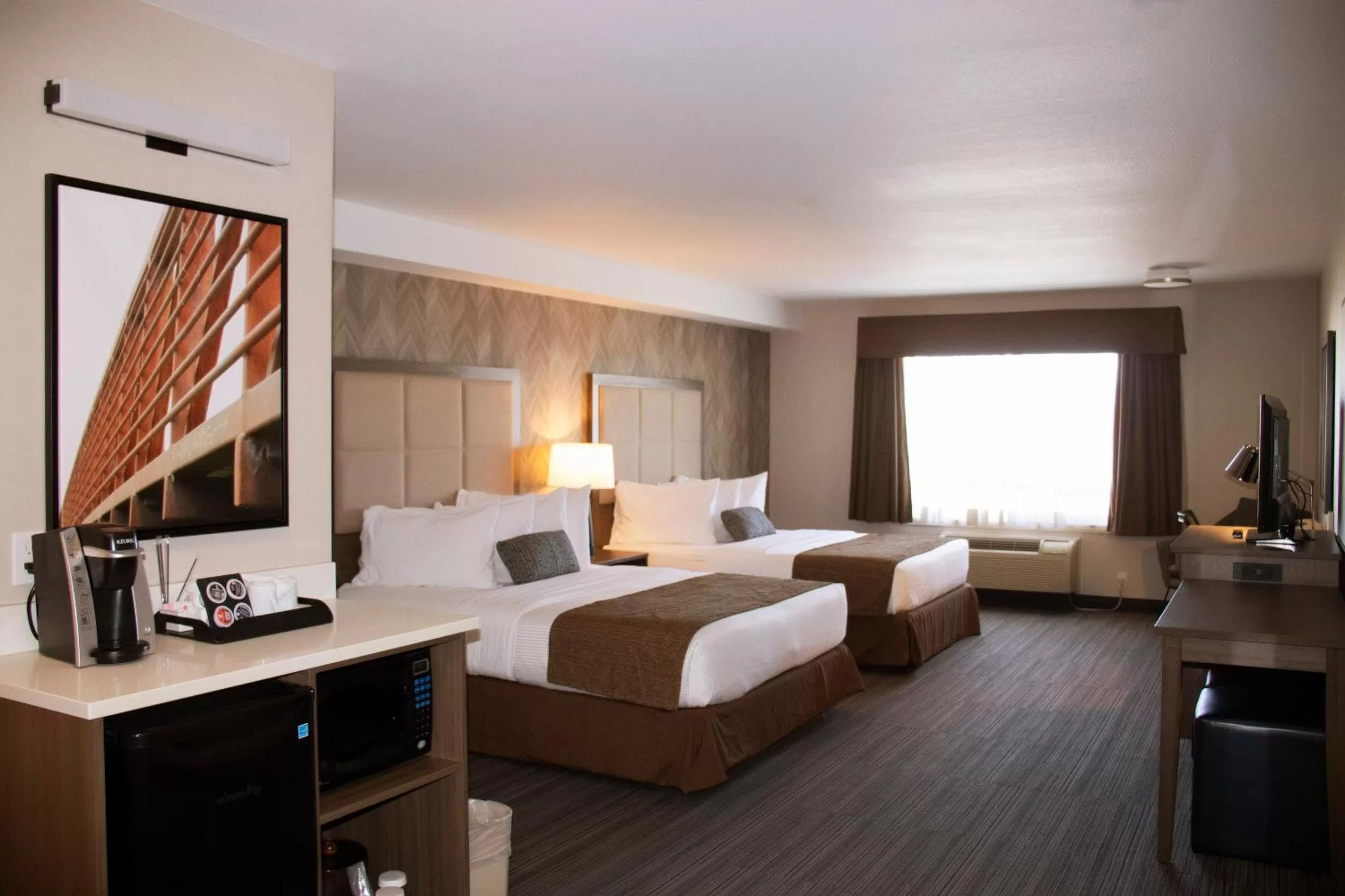 Photo of the whole room, Bed in Ramada by Wyndham Airdrie Hotel & Suites