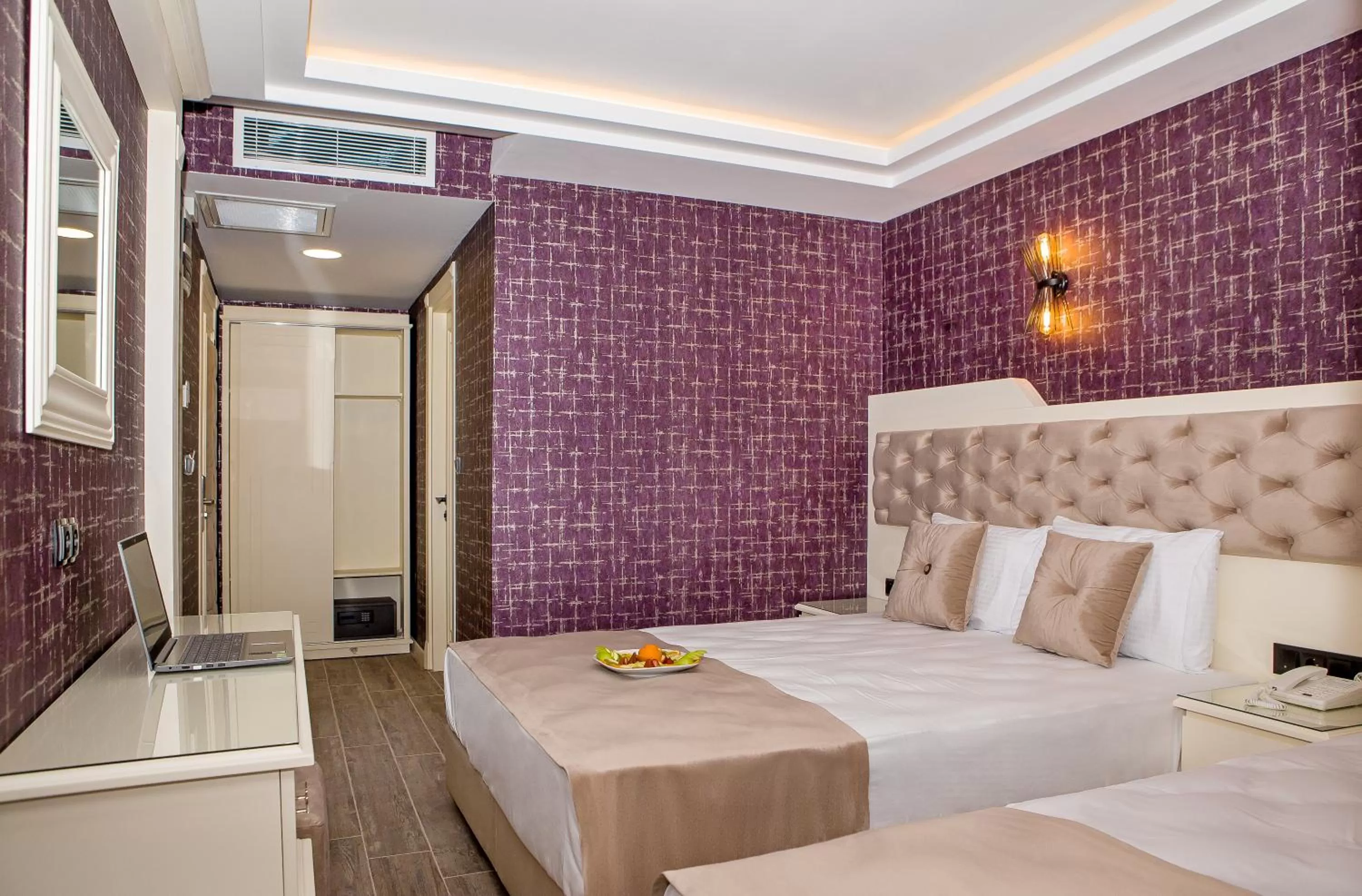 Bed in THE LEA HOTELS & SUITE