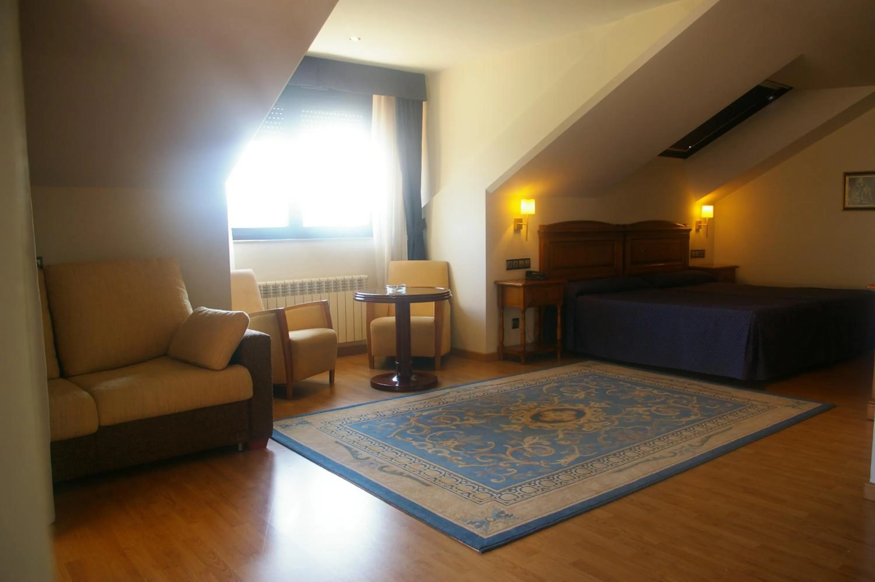 Living room, Bed in Hotel Cristina