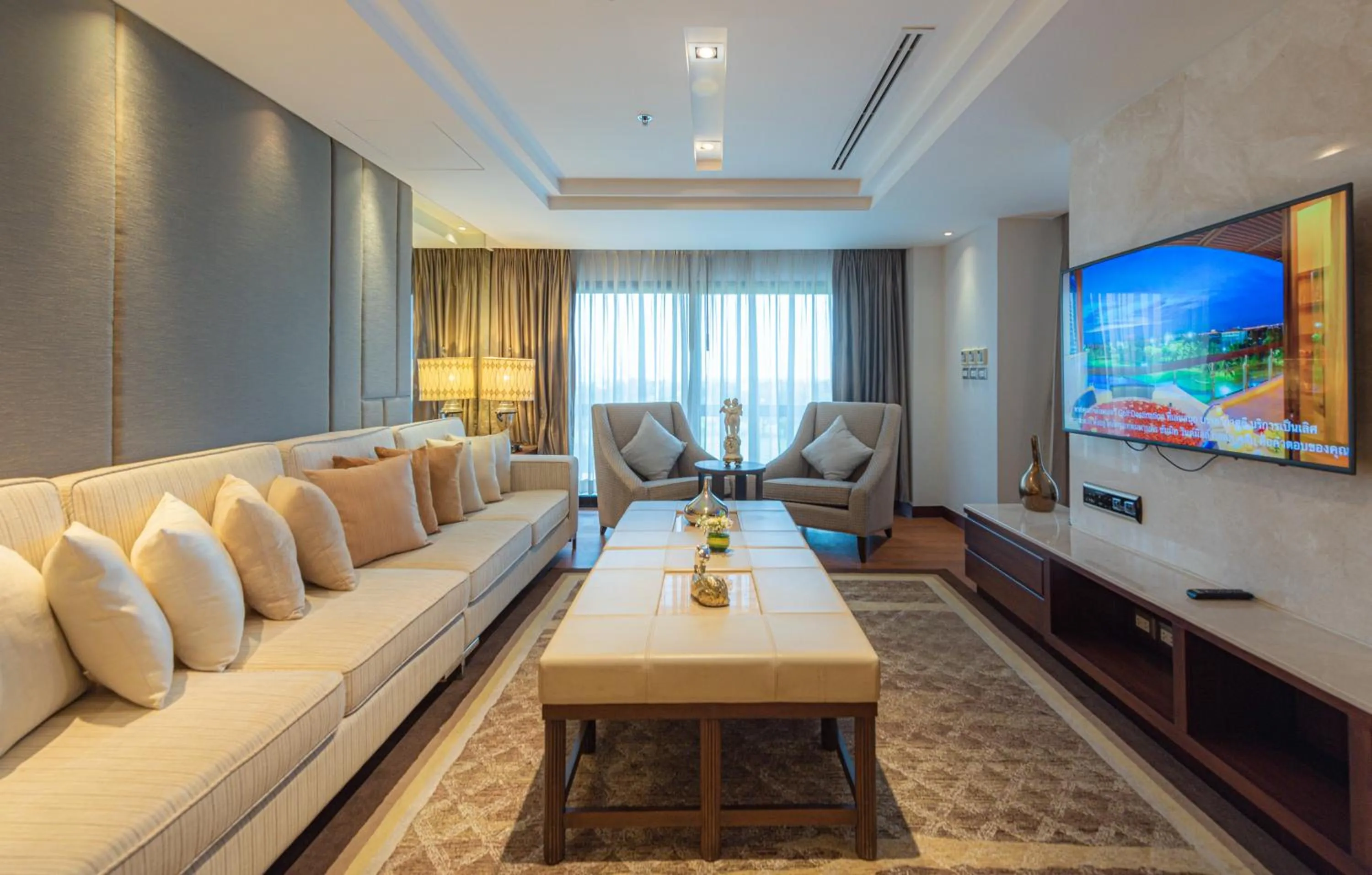 Living room in Summit Windmill Golf Suite Hotel at Suvarnabhumi