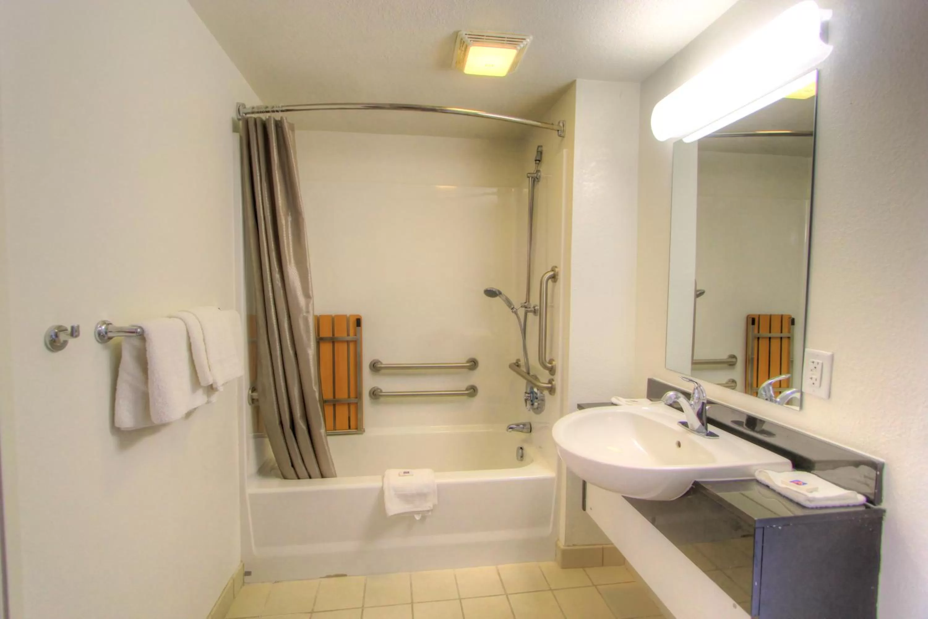 Bathroom in Howard Johnson by Wyndham Harrisonburg