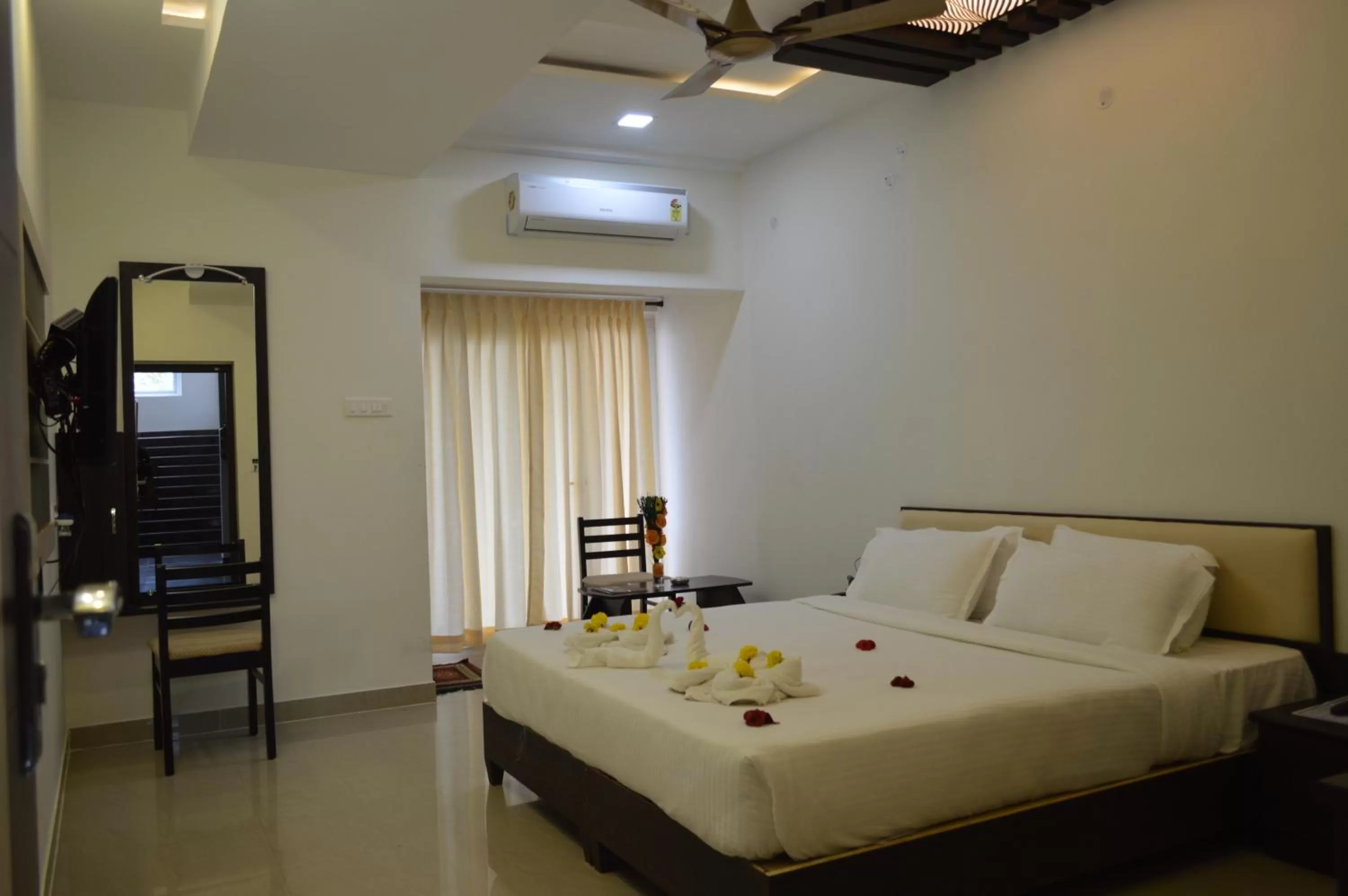 Bed in Hotel Ambai Grand