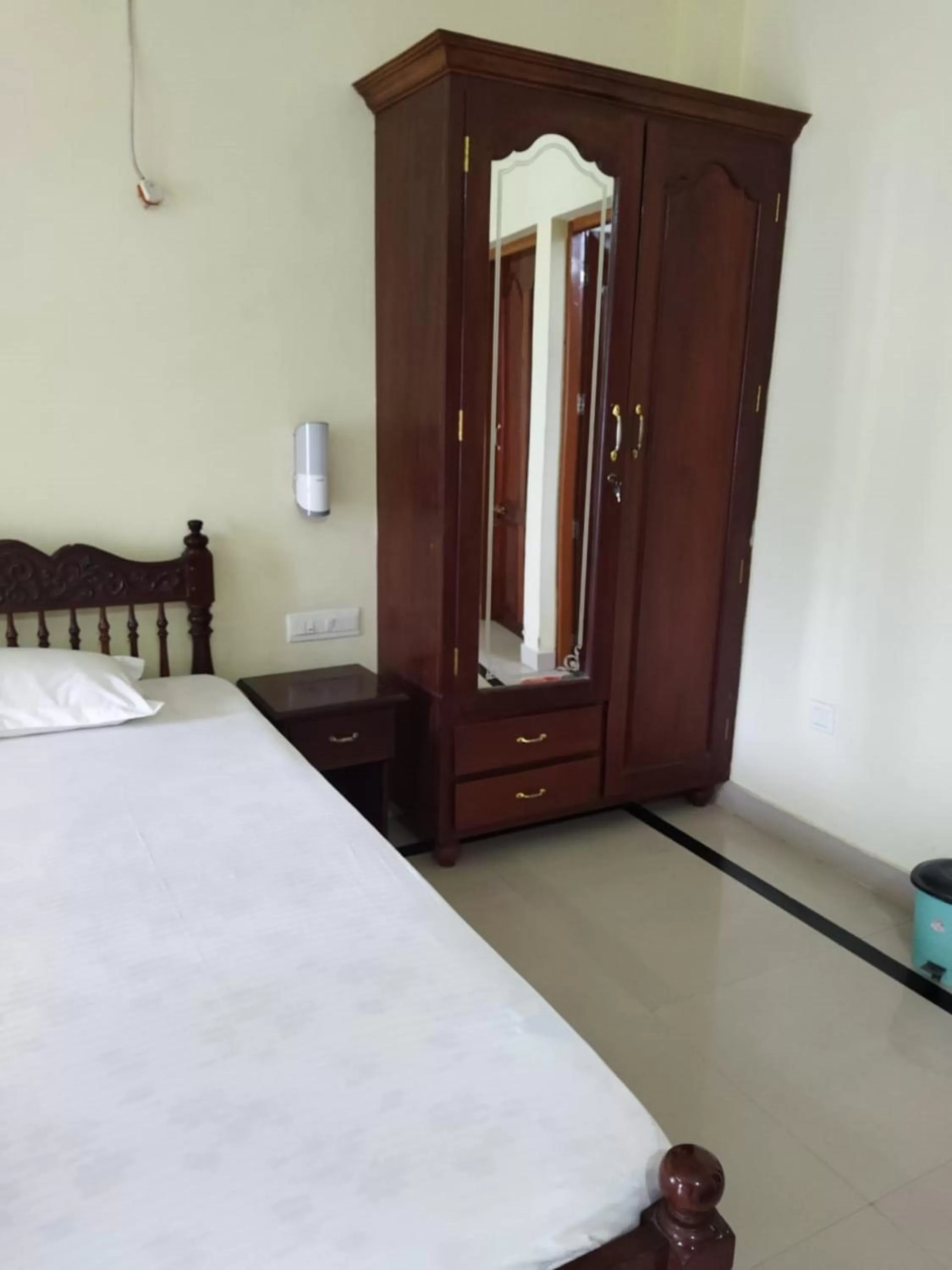 Bed in Sree Mookambika Beach Resort