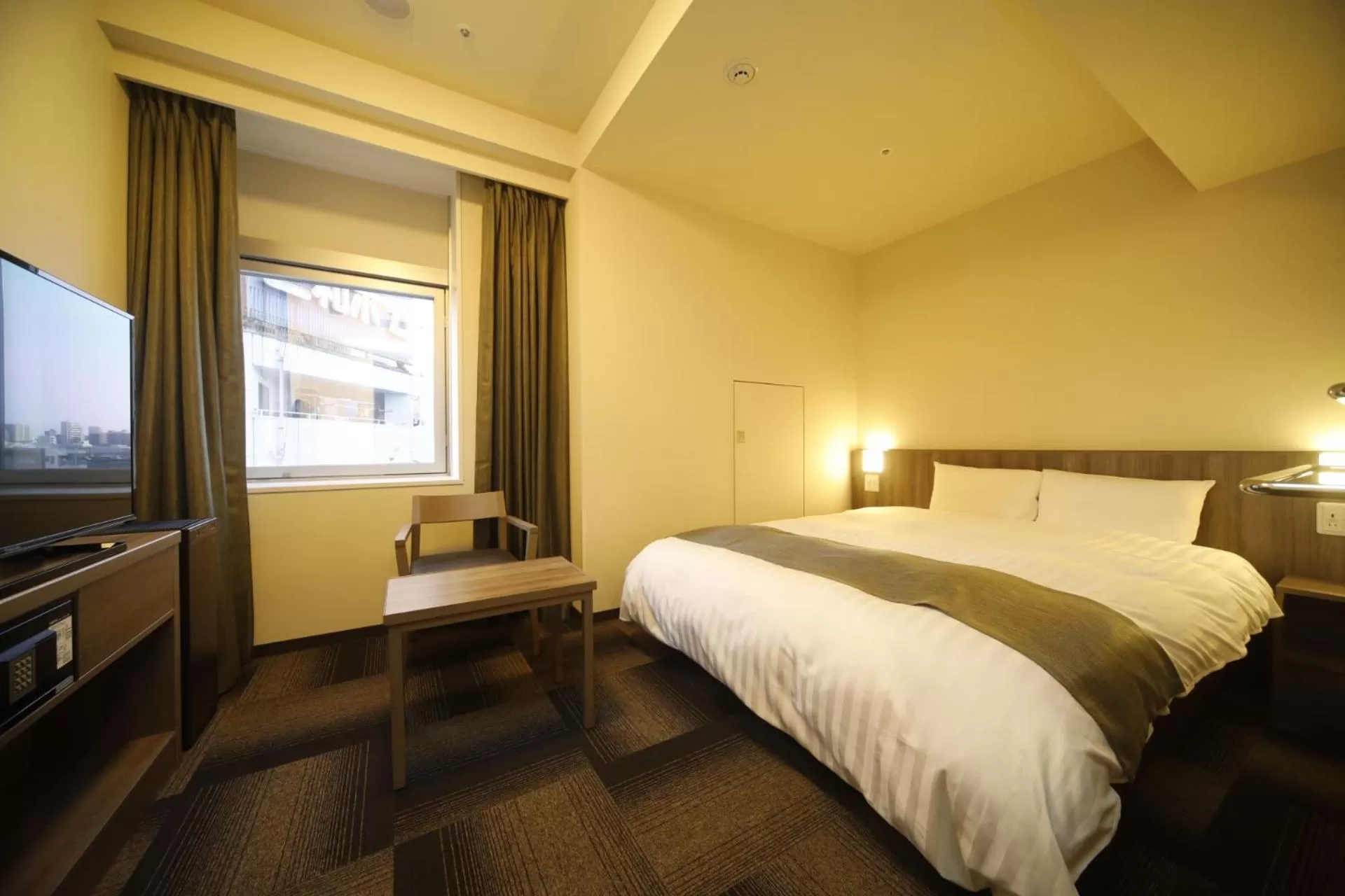 Bed in Dormy Inn Korakuen