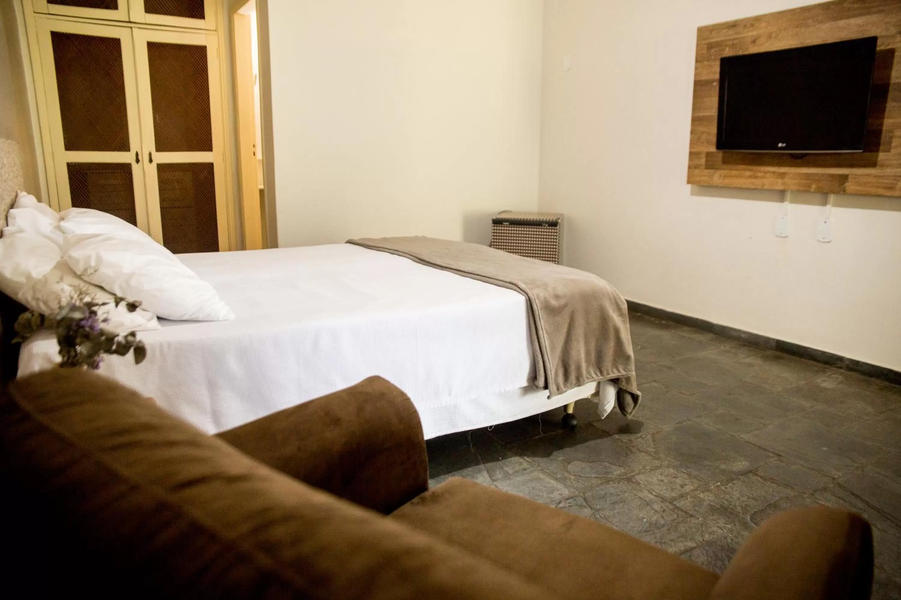 Bed in Pousada Flor da Serra