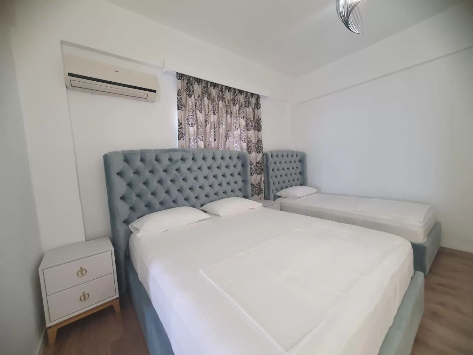 Bed in Murati Suites Sarandë