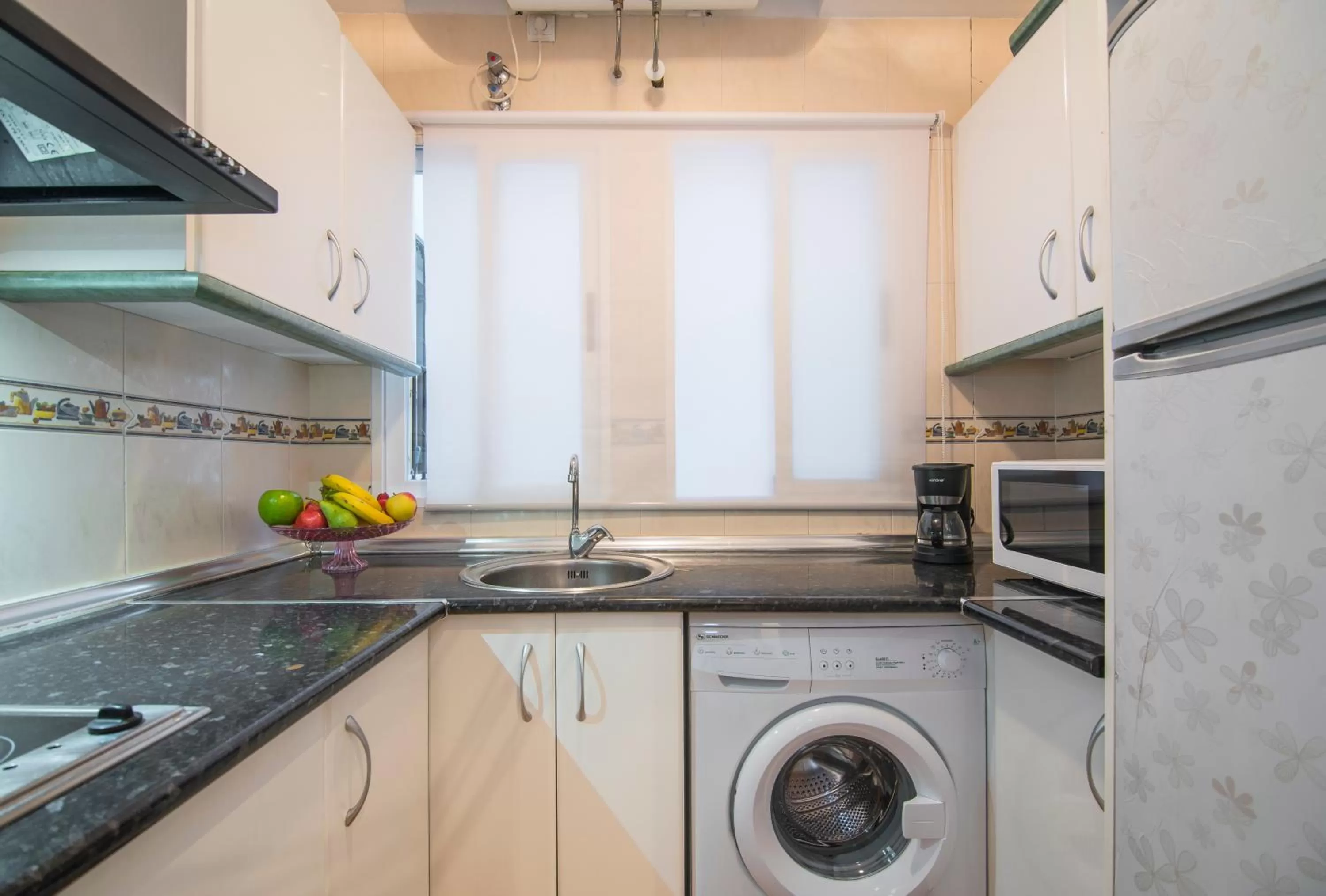 Kitchen or kitchenette in Apartamentos Granata