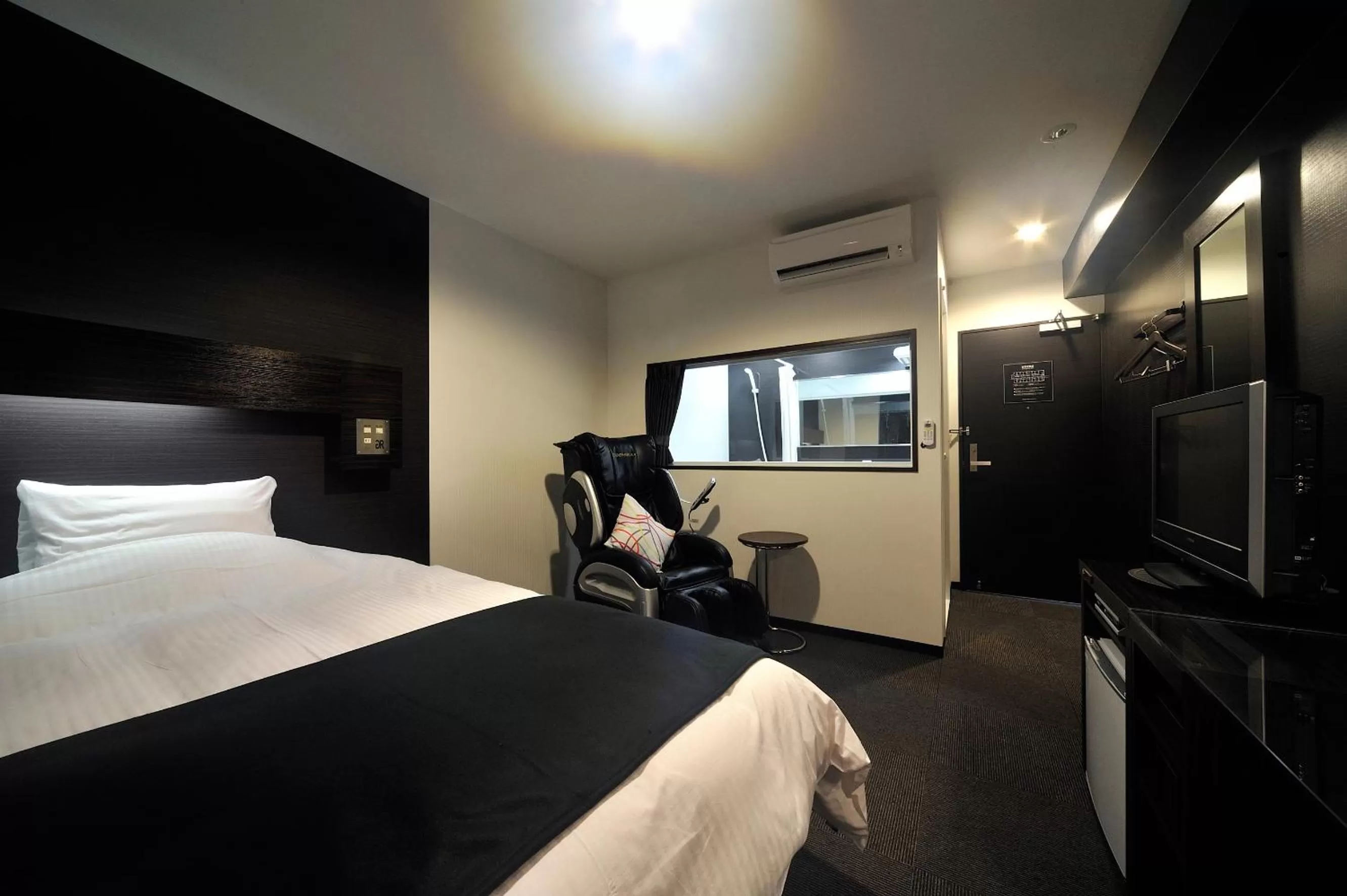 Bed in Green Rich Hotel Iwakuni Ekimae (Artificial hot spring Futamata Yunohana)