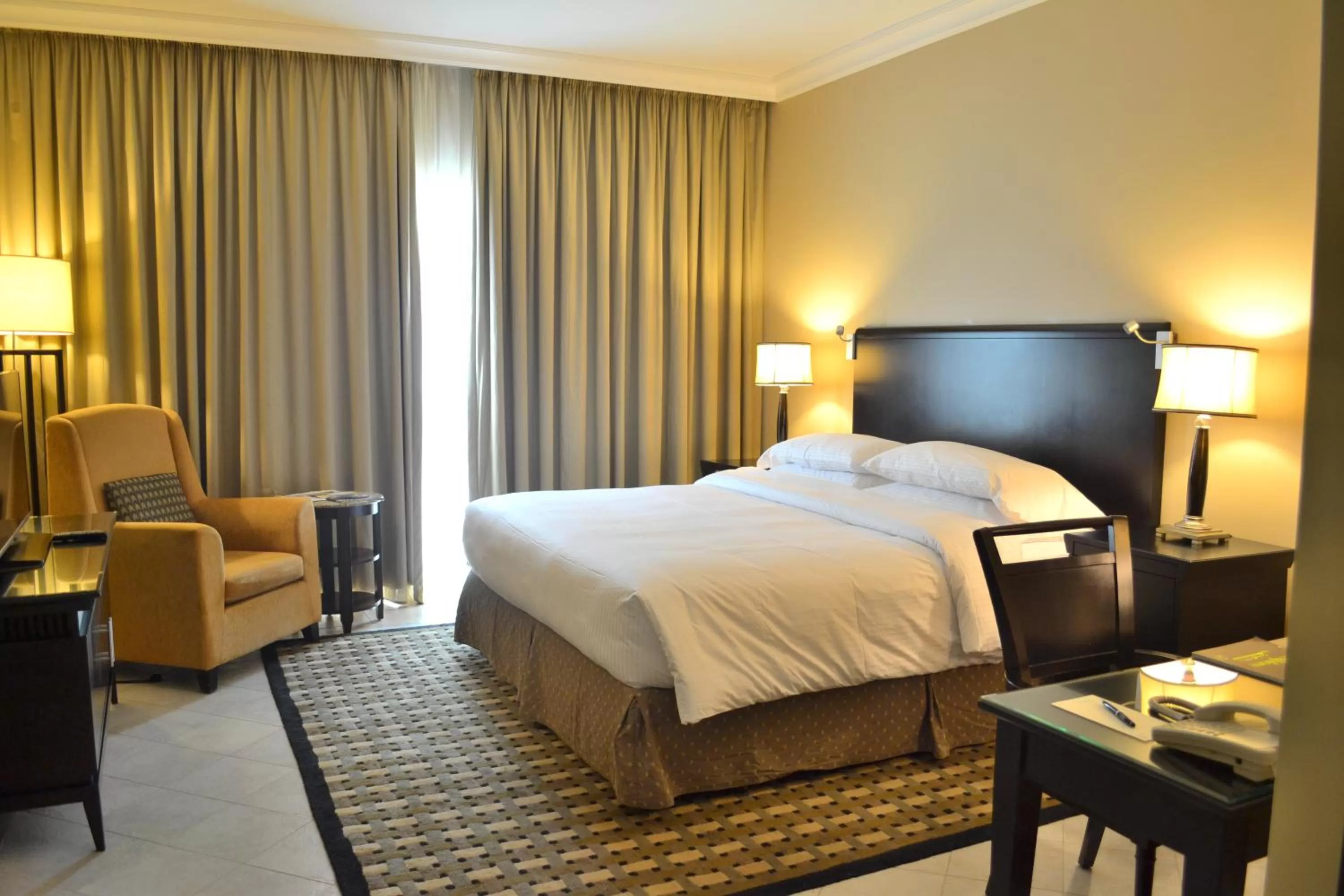 Bed in Sheraton Khalidiya Hotel