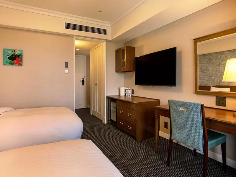 Bed in SHIROYAMA HOTEL kagoshima