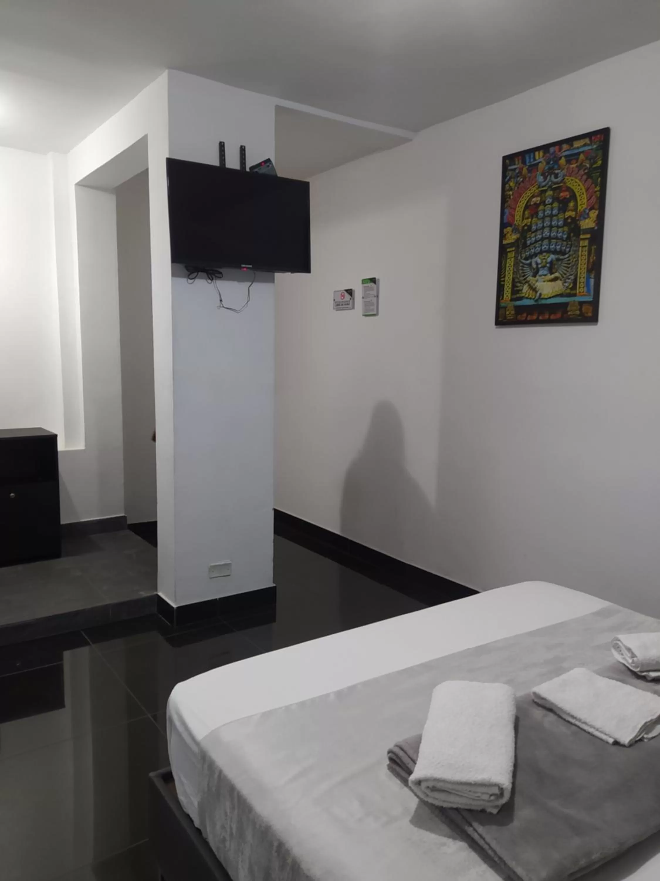 TV and multimedia, TV/Entertainment Center in Hotel Aura Medellin