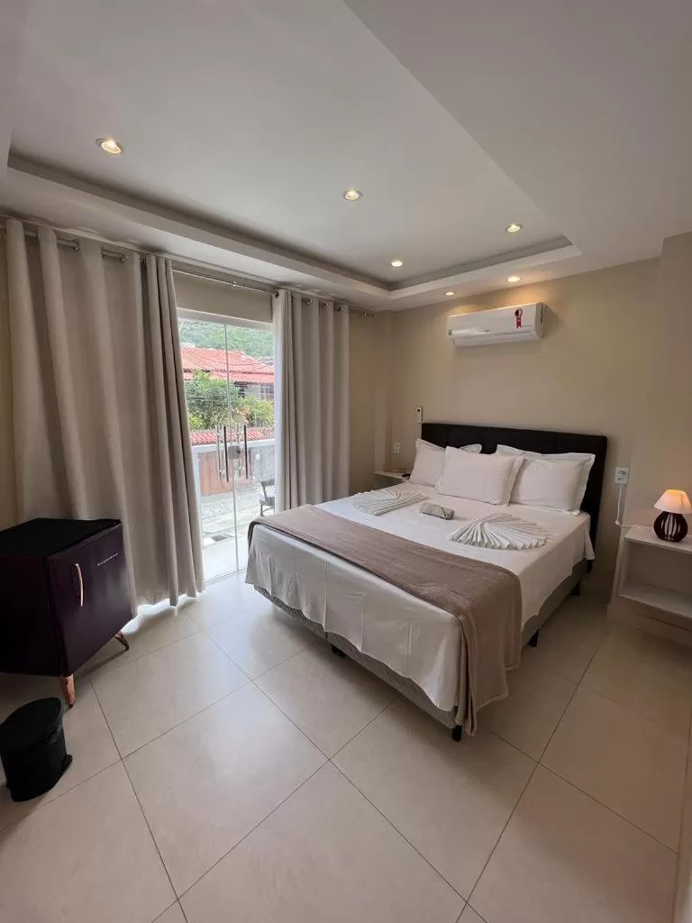 Bed in Pousada Arraial Tropical