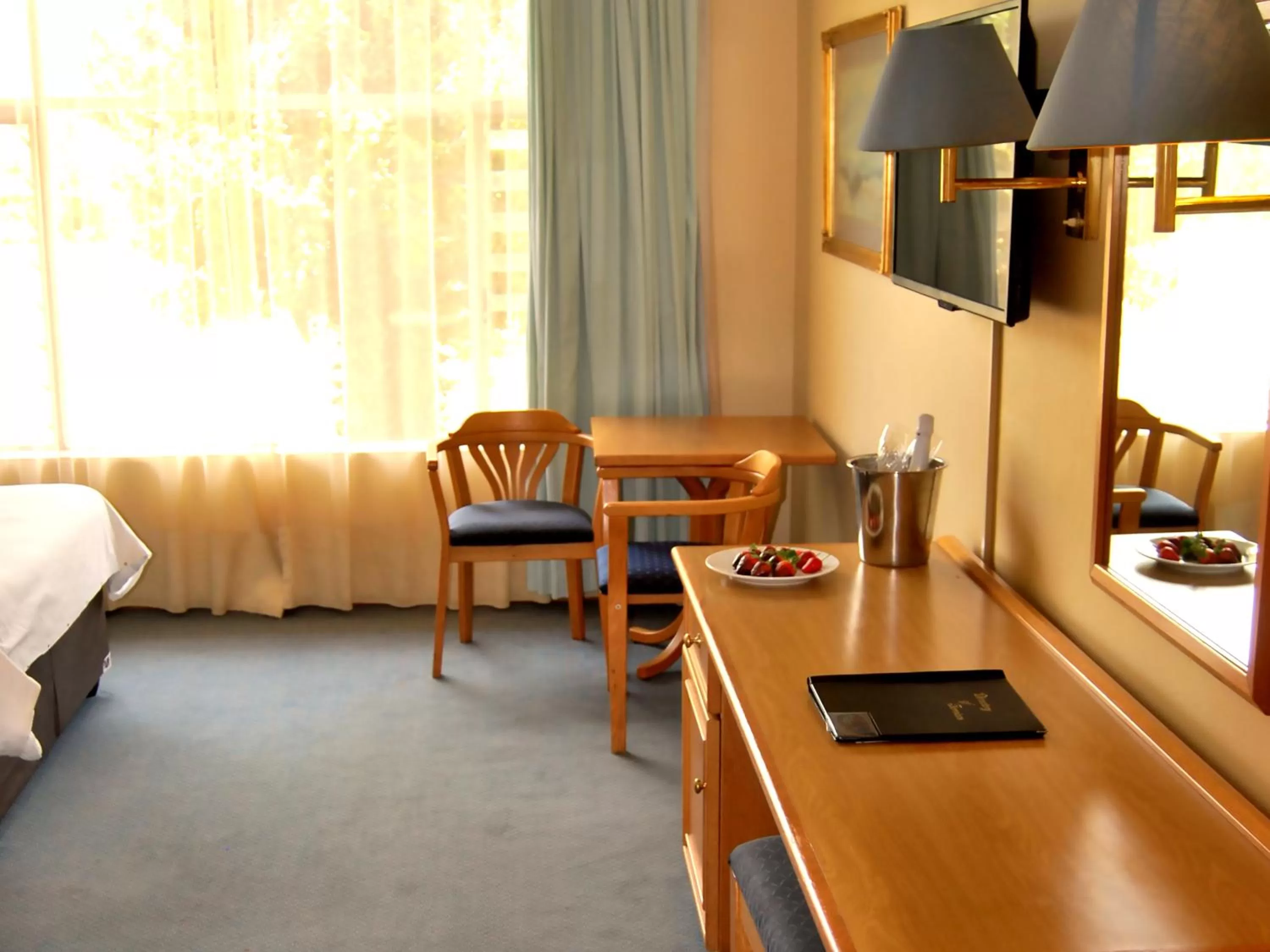 Seating area, Bed in Safari Hotel & Convention Centre