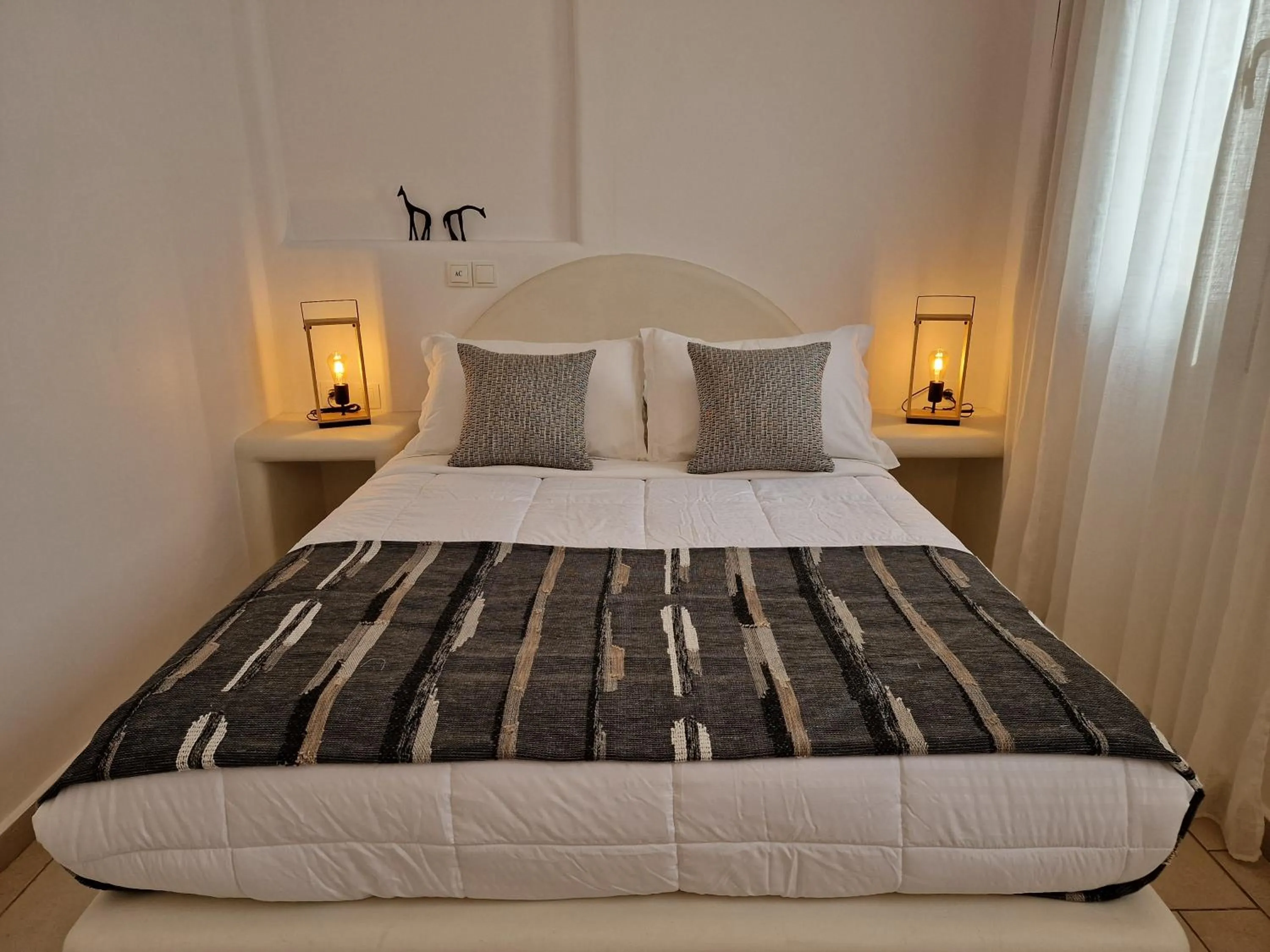 Bed in Amerisa Suites & Villa