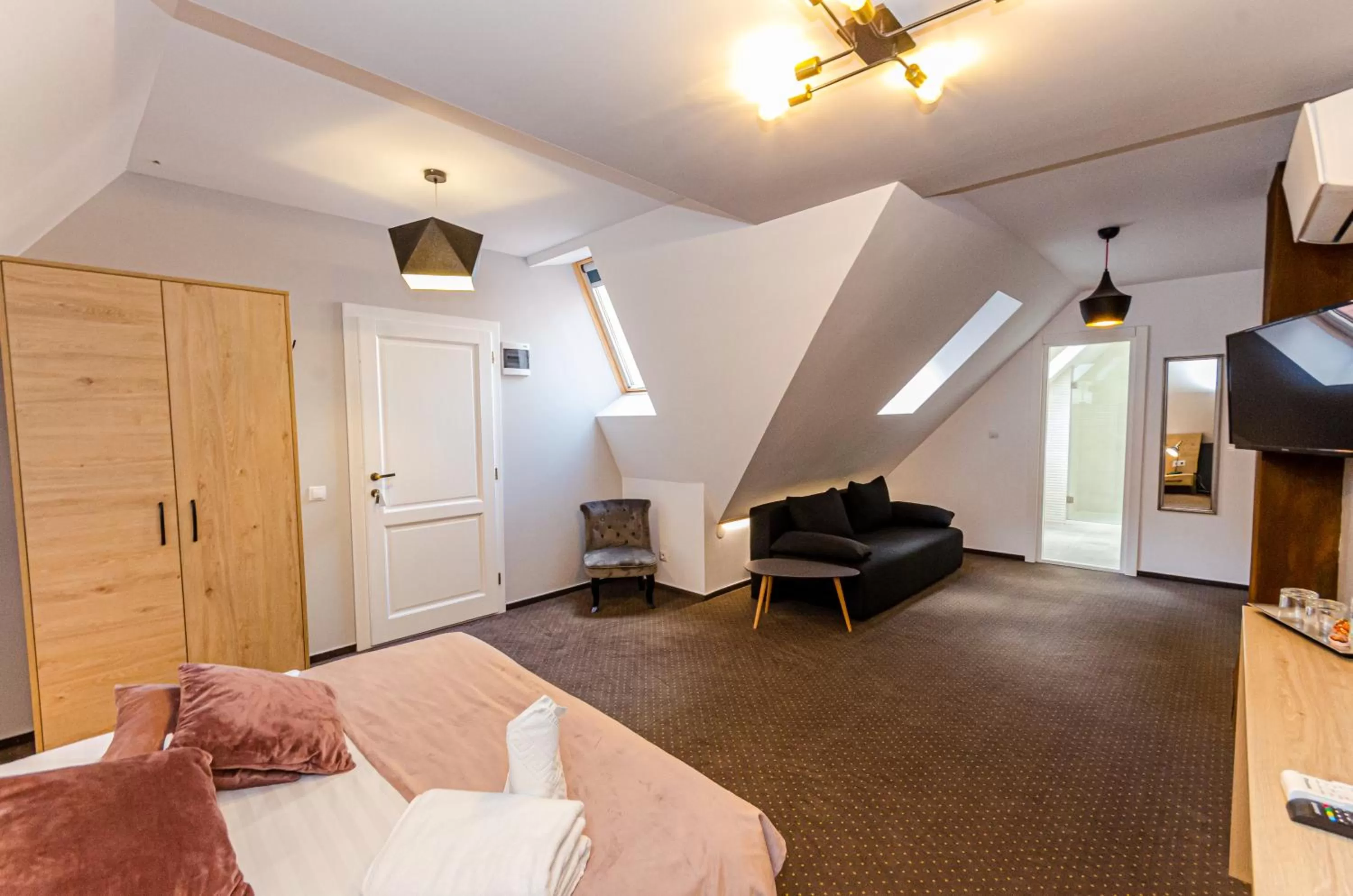 Seating area, Bed in Lumiere House Sibiu