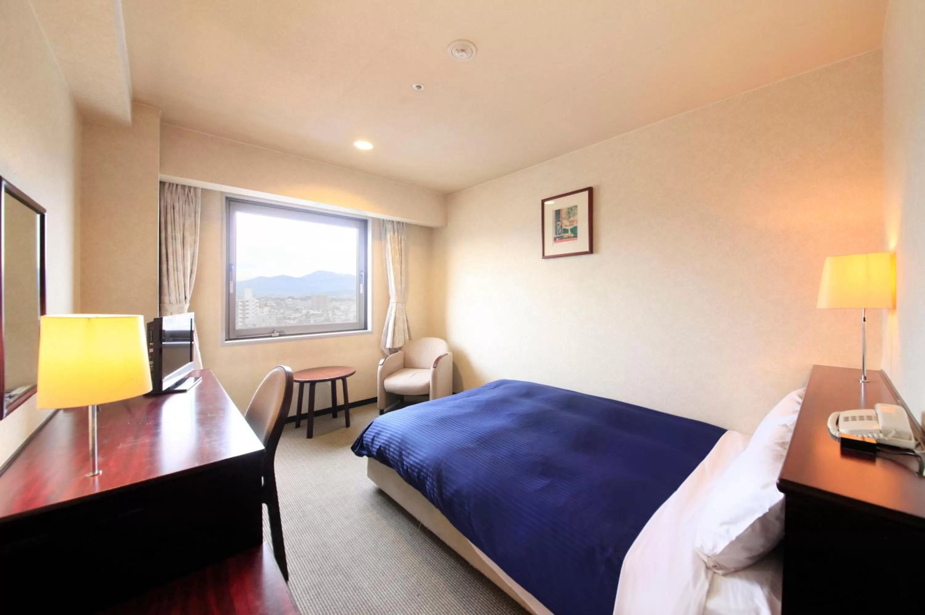 Photo of the whole room, Bed in Quintessa Hotel Ogaki