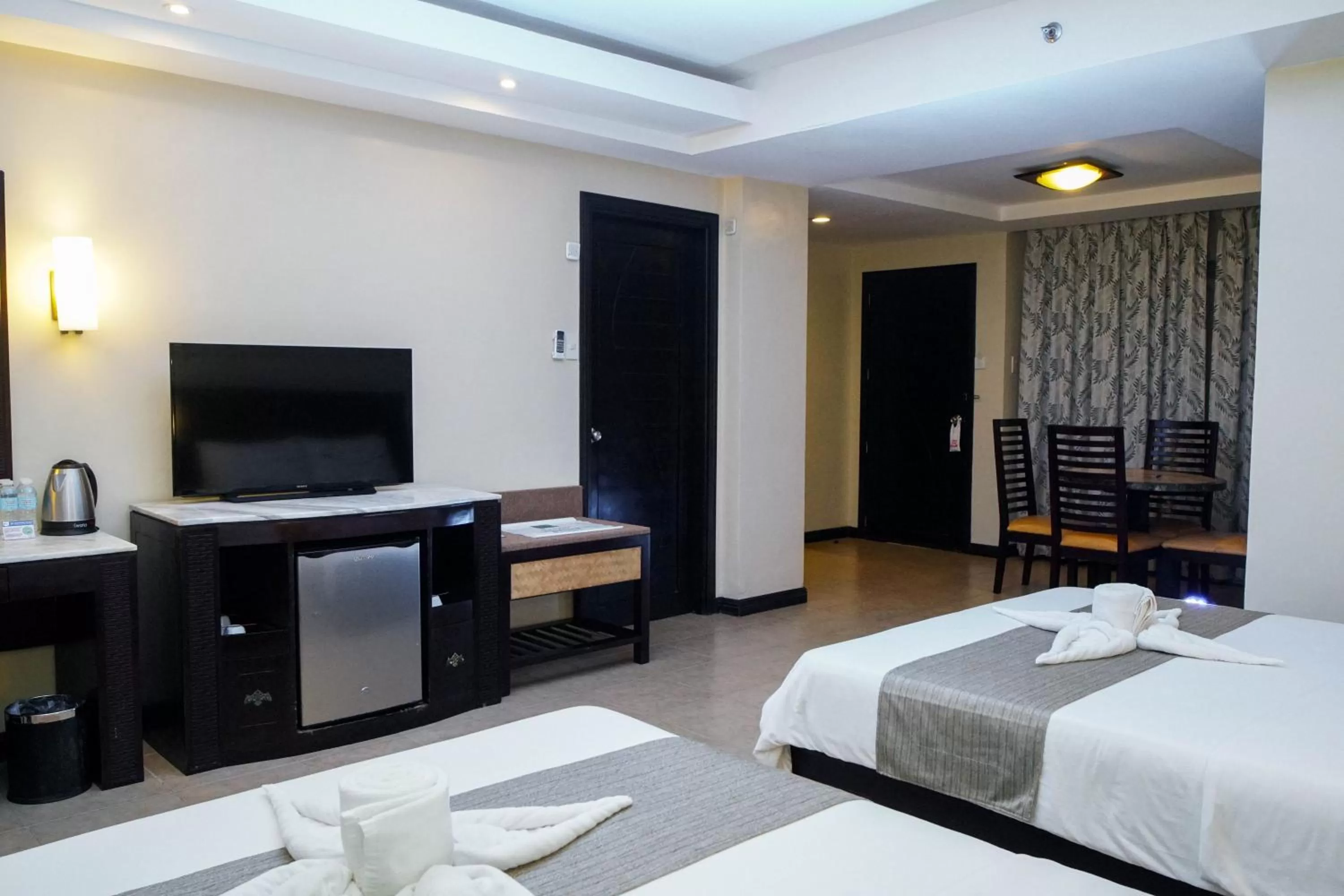 Photo of the whole room, Bed in Coron Westown Resort