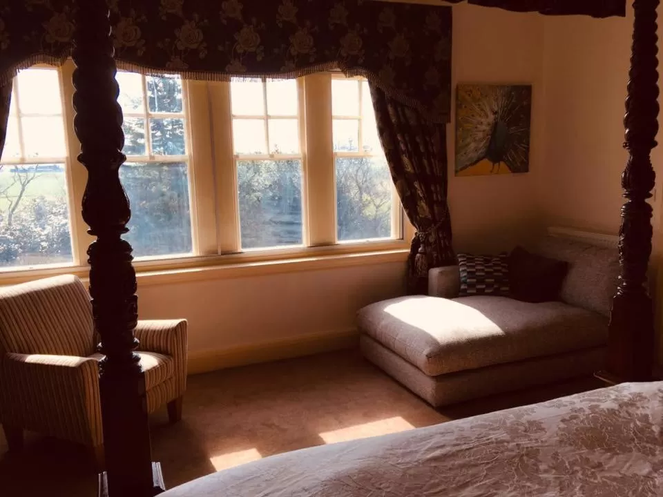 Bed in Brass Castle Country House Accommodation