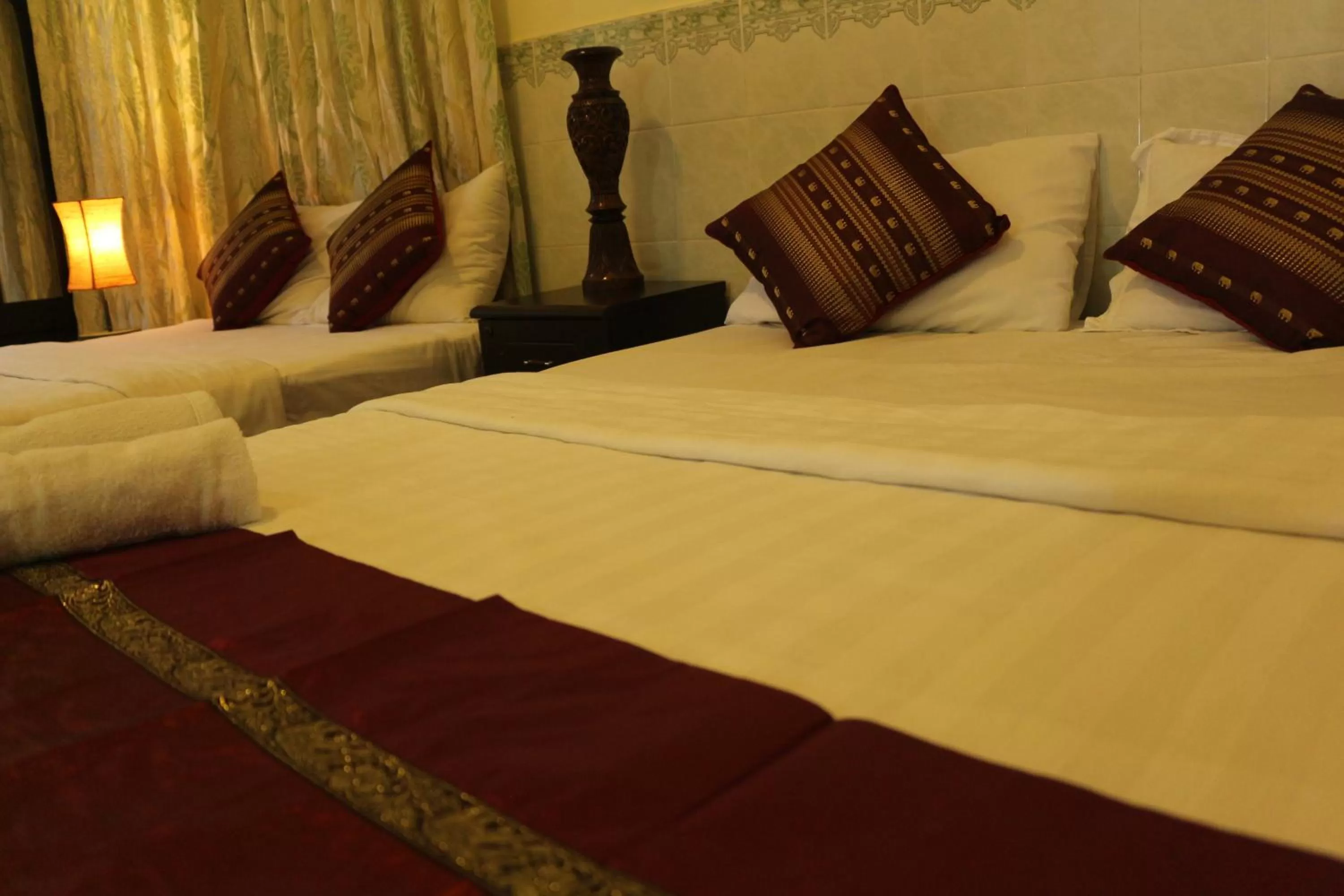 Bed in New Season Riverside Hotel