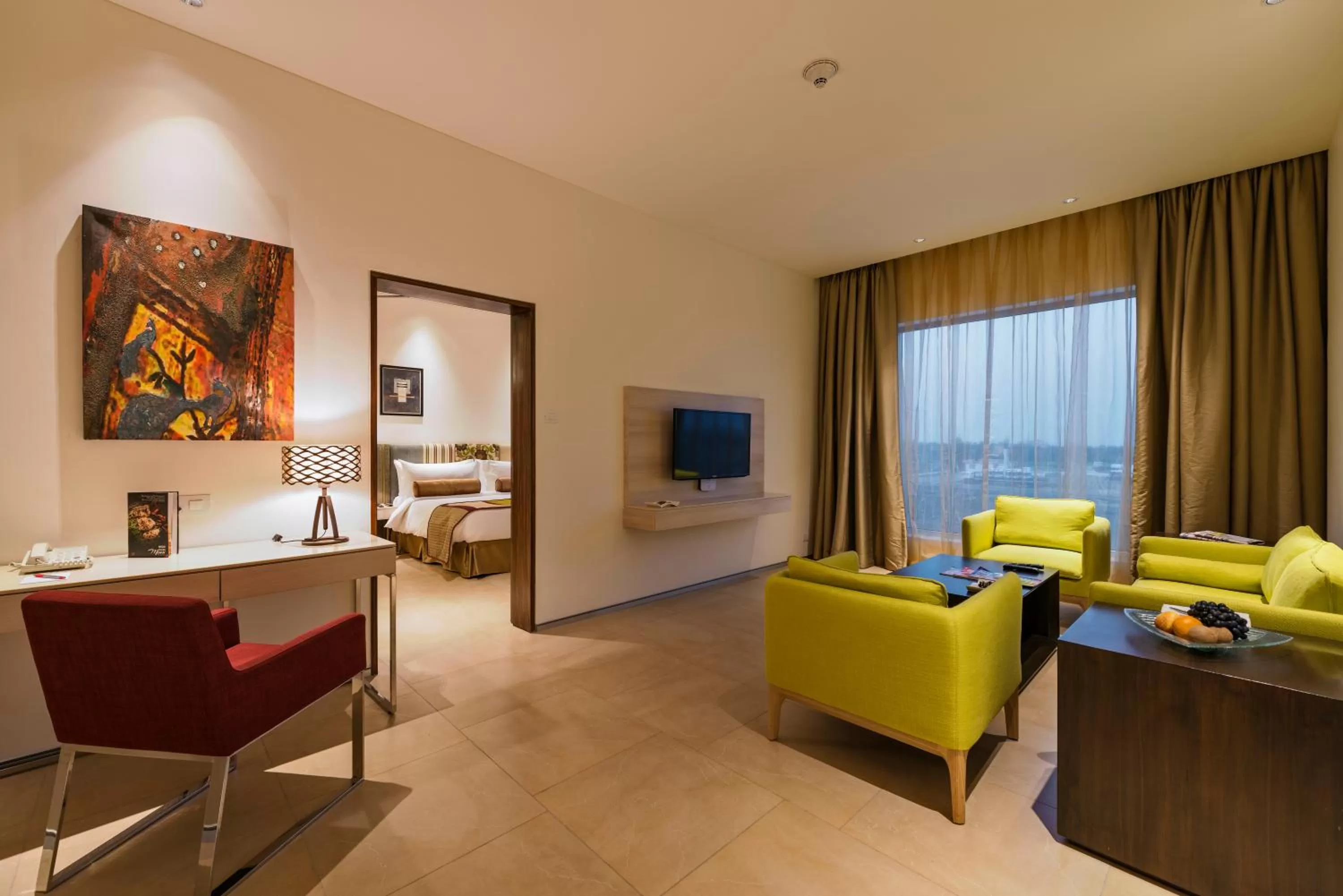 Bed, Seating Area in Jakson Inns