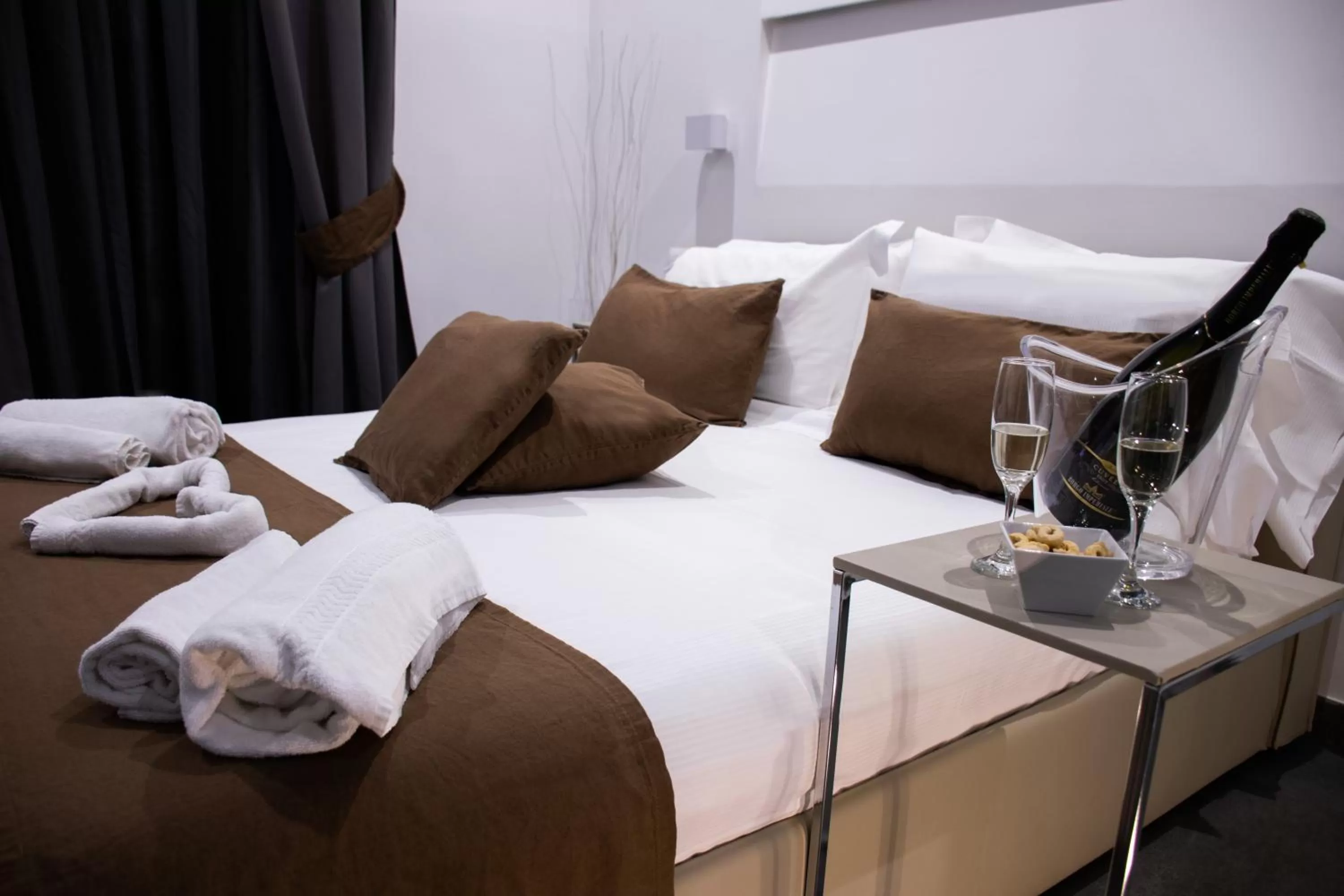 Bed in Megaris Luxury Suite Rooms