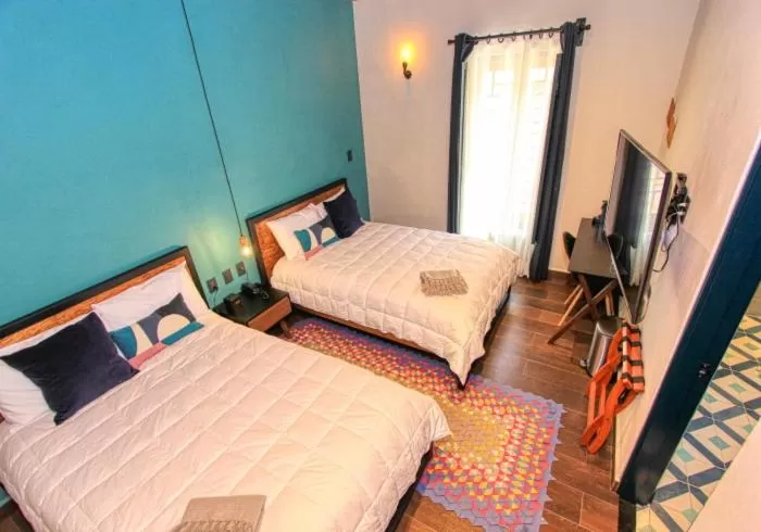 Photo of the whole room, Bed in Antigua Trece Hotel Fusión & SPA