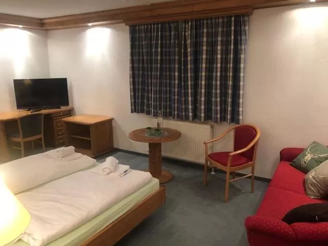 Photo of the whole room, Bed in Alpenhotel Widderstein