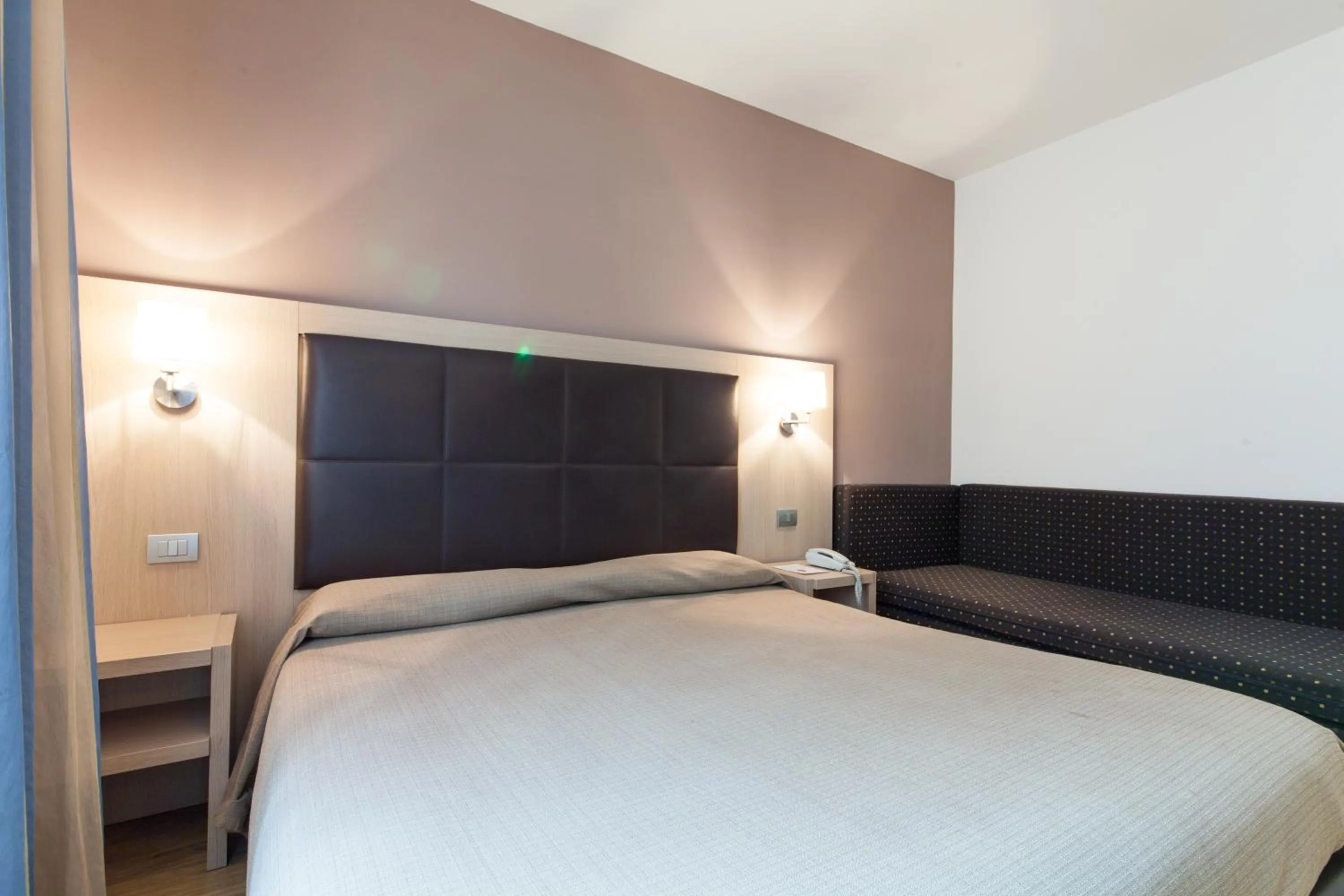 Bed in Hotel Michelangelo