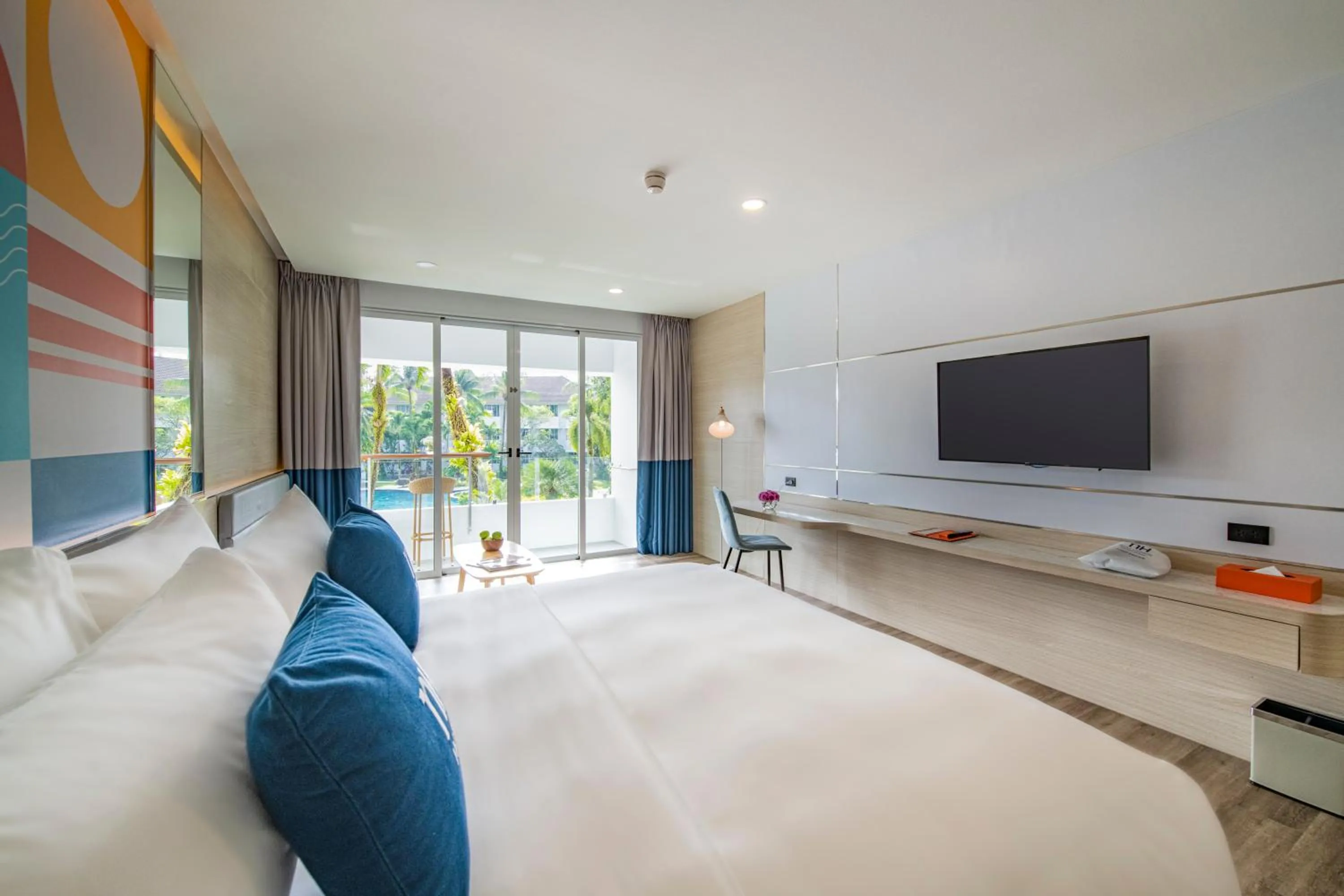 Bed in NH Boat Lagoon Phuket Resort