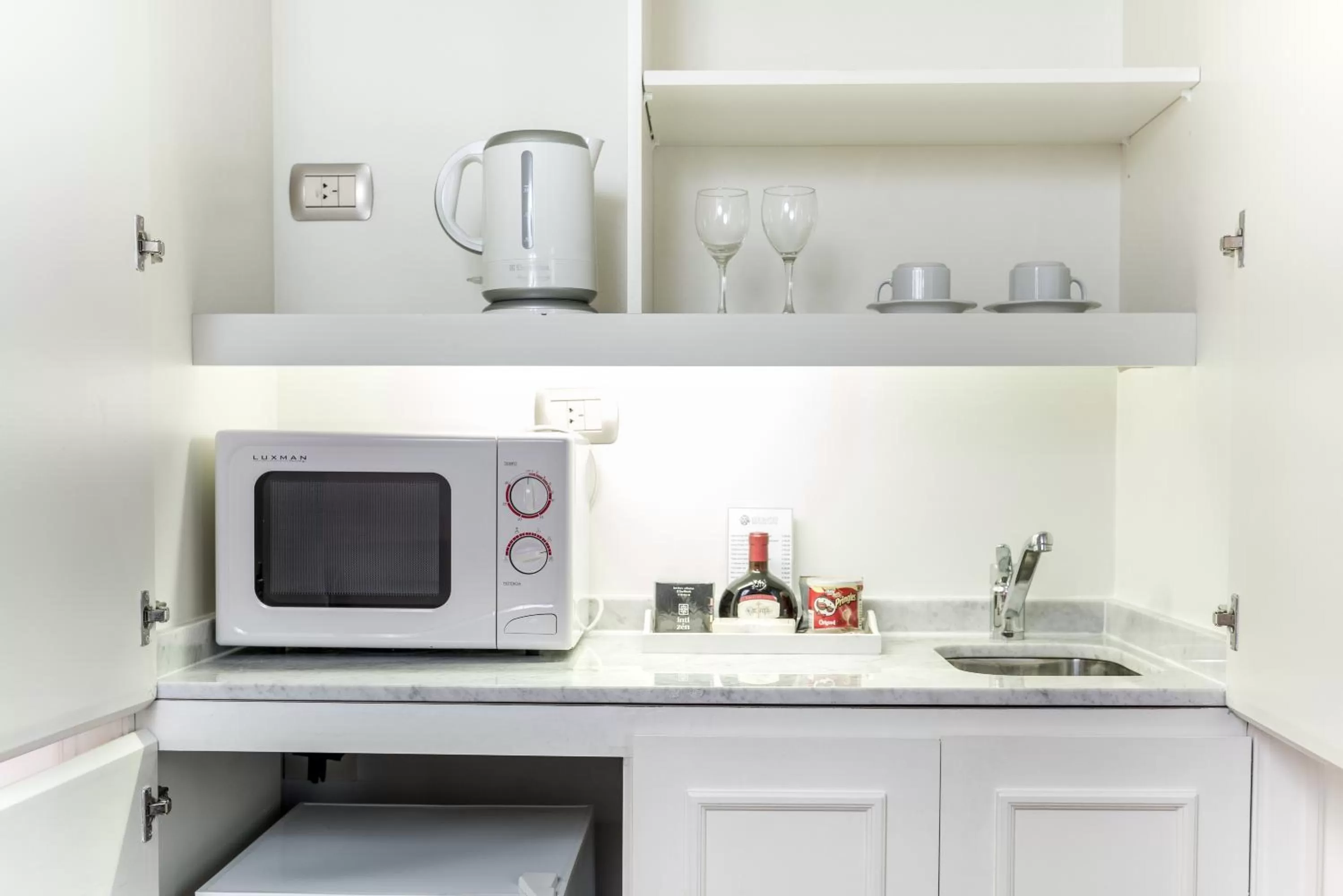 Kitchen or kitchenette in Loi Suites Recoleta Hotel