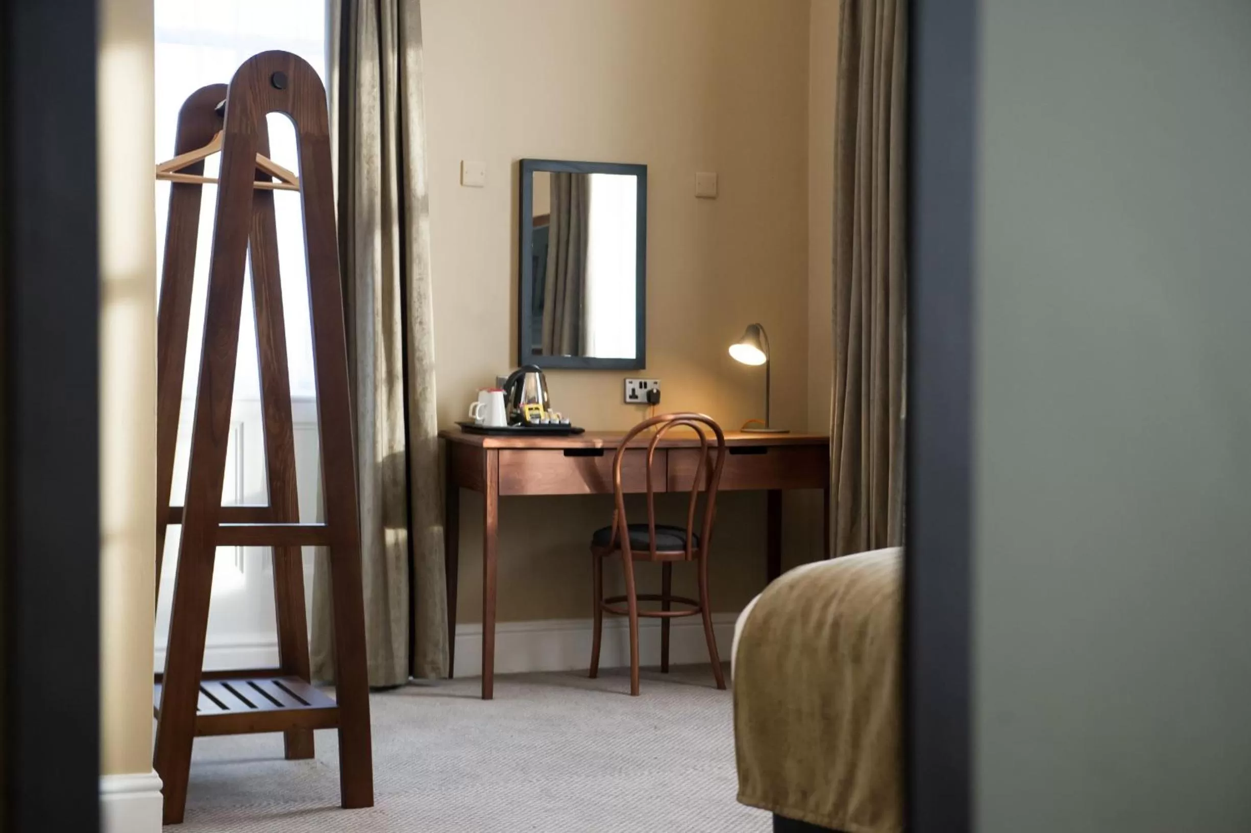 Photo of the whole room, TV/Entertainment Center in The Cheshire Cat by Innkeeper's Collection