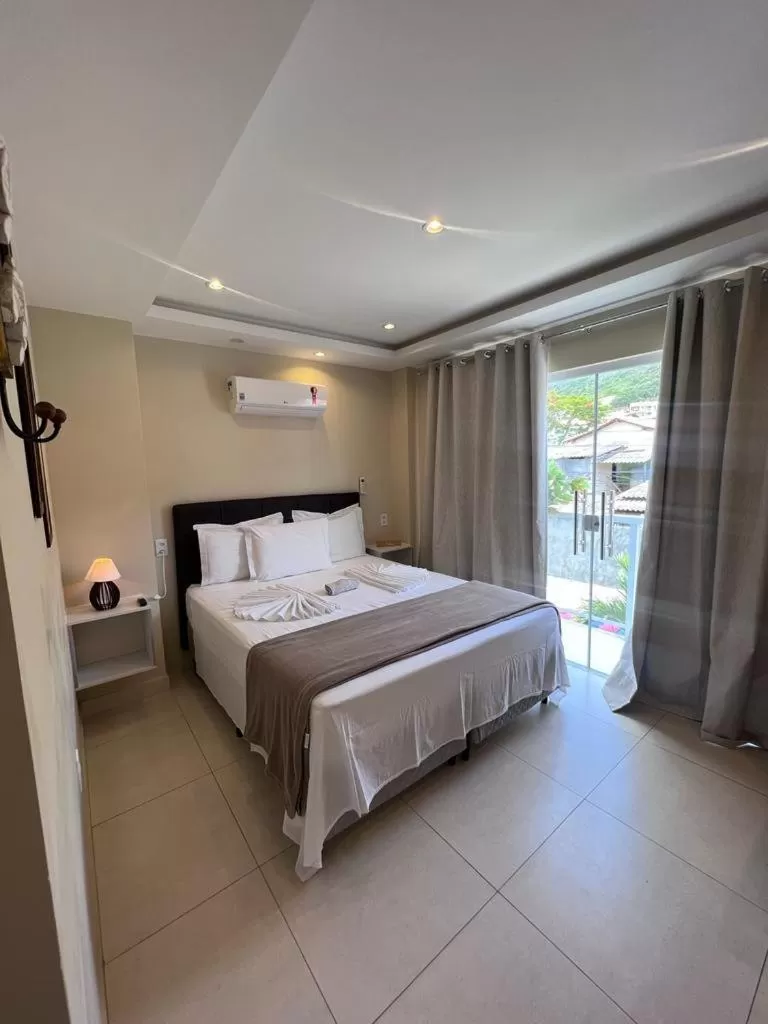 Bed in Pousada Arraial Tropical