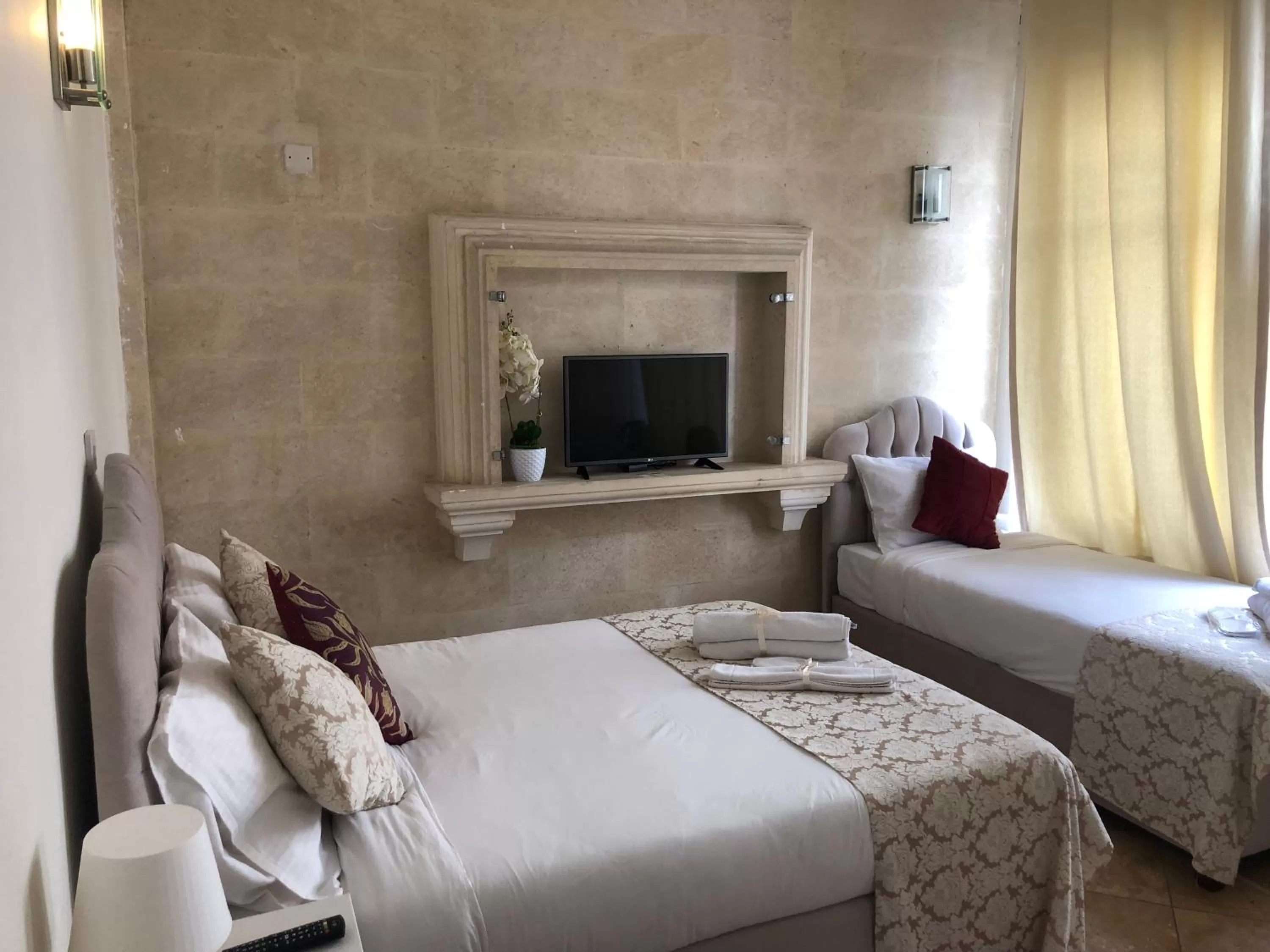 Bed in Lord's Residence Boutique Hotel