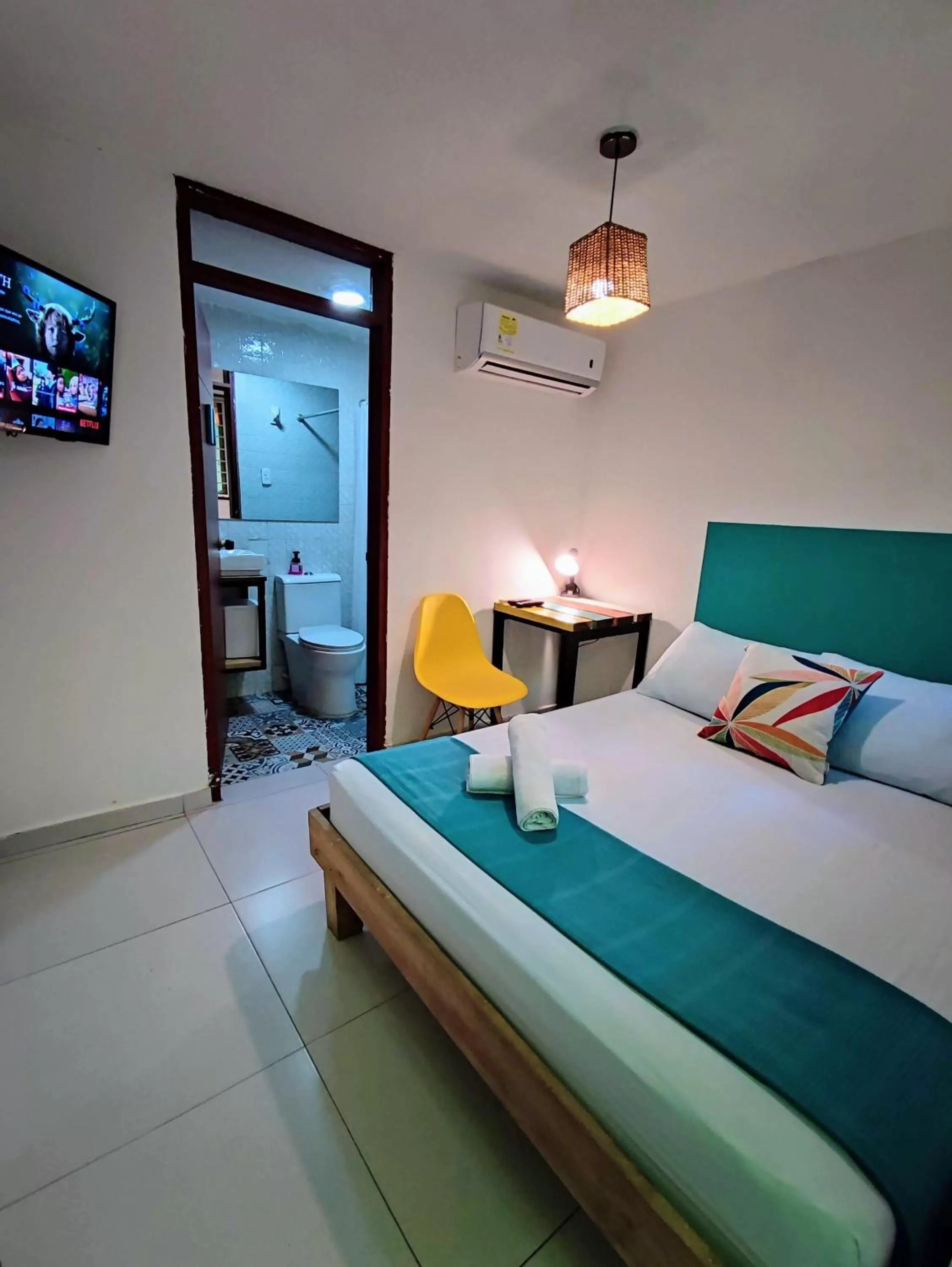 Bed in Bona Vida Hotel