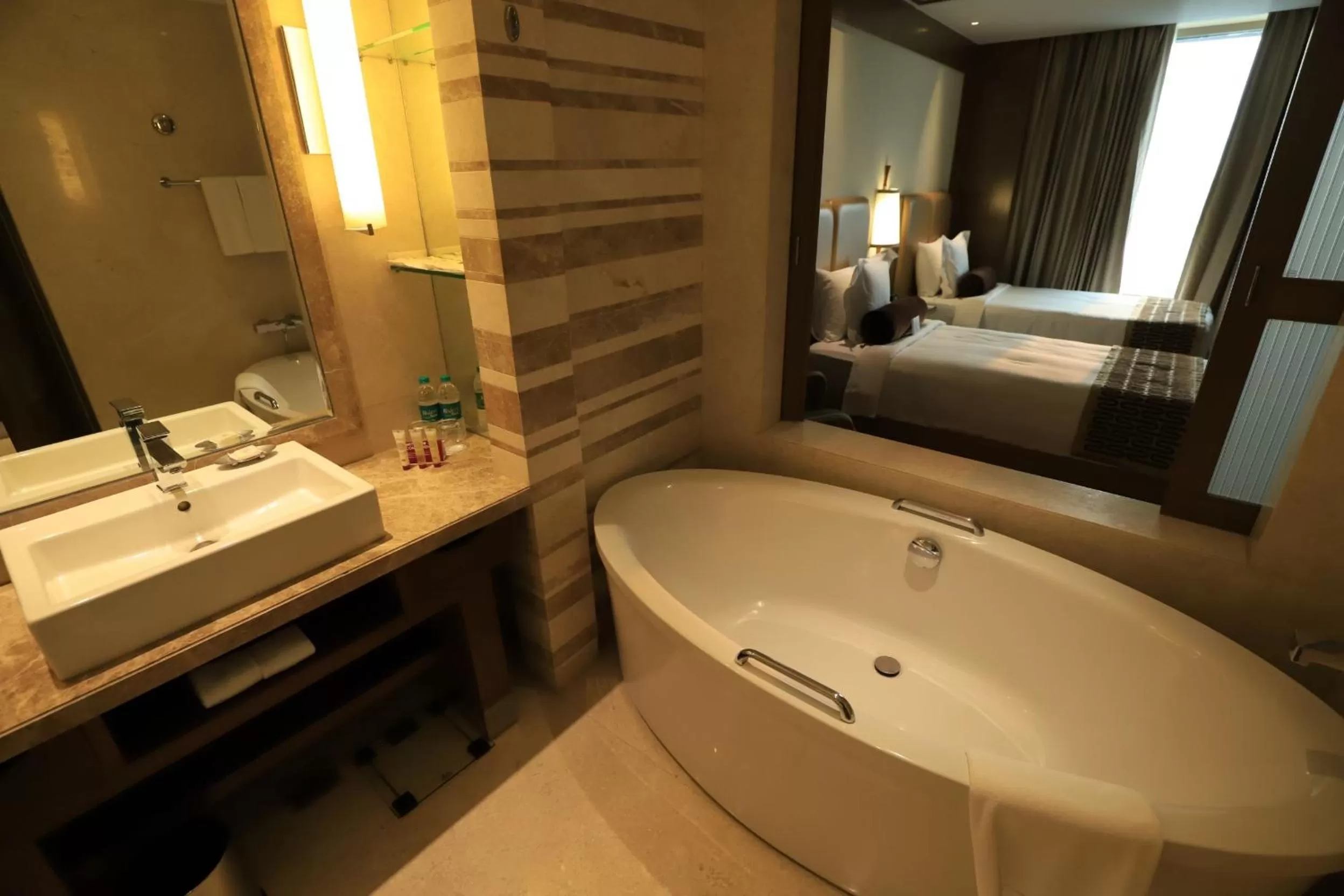 Bathroom, Bed in Crowne Plaza New Delhi Okhla by IHG