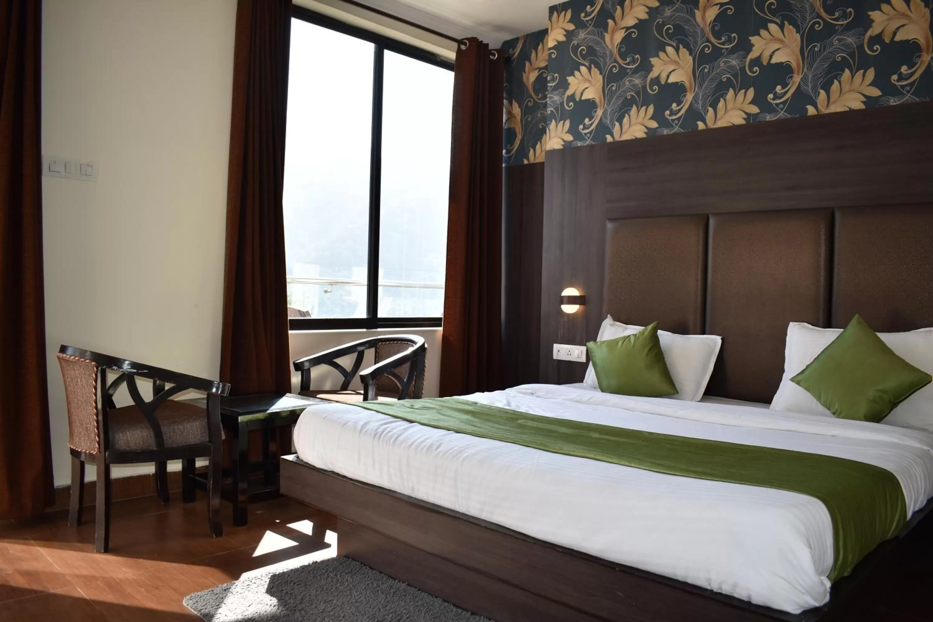 Mountain view, Bed in Tapasthali by Meera Hotels