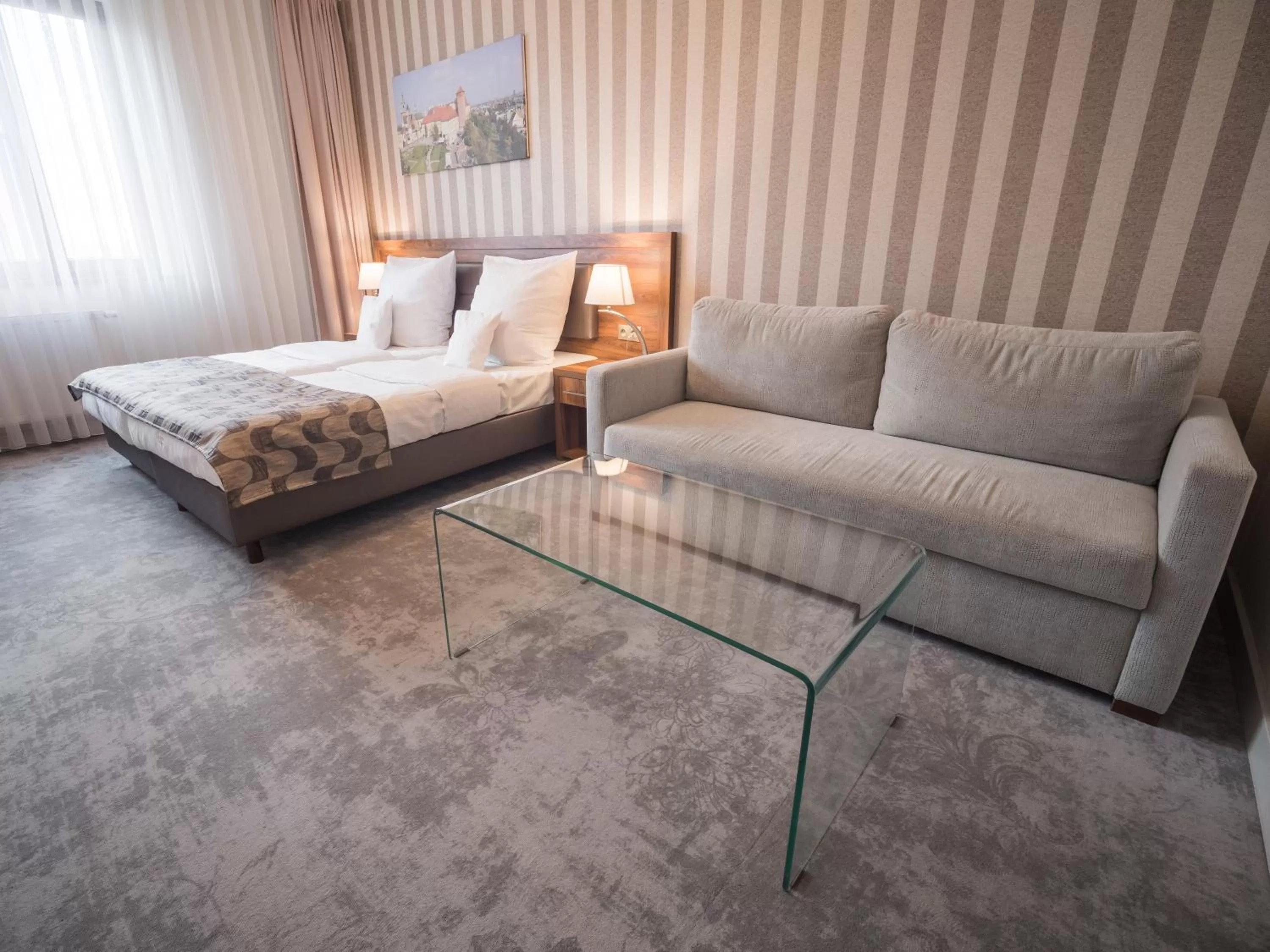 Seating area, Bed in Hotel Miodowa