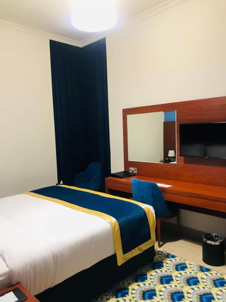 Bed in BANIYAS PLAZA HOTEL APARTMENTS